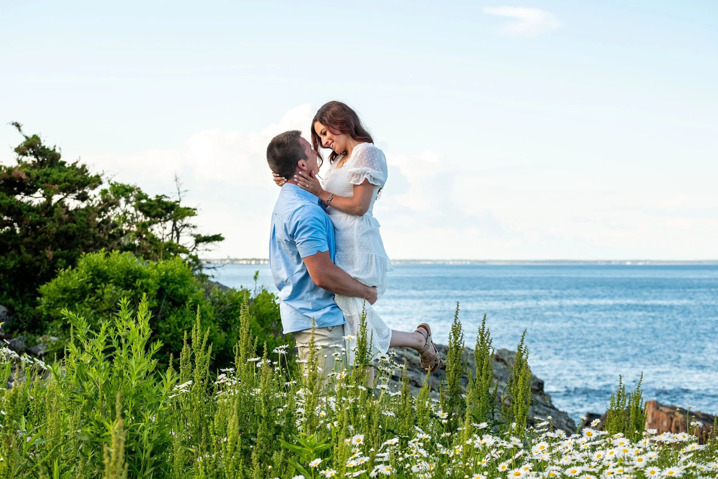 Couple embracing on Marginal Way overlooking the ocean, Ogunquit, Maine, engagement session by VMG Productions