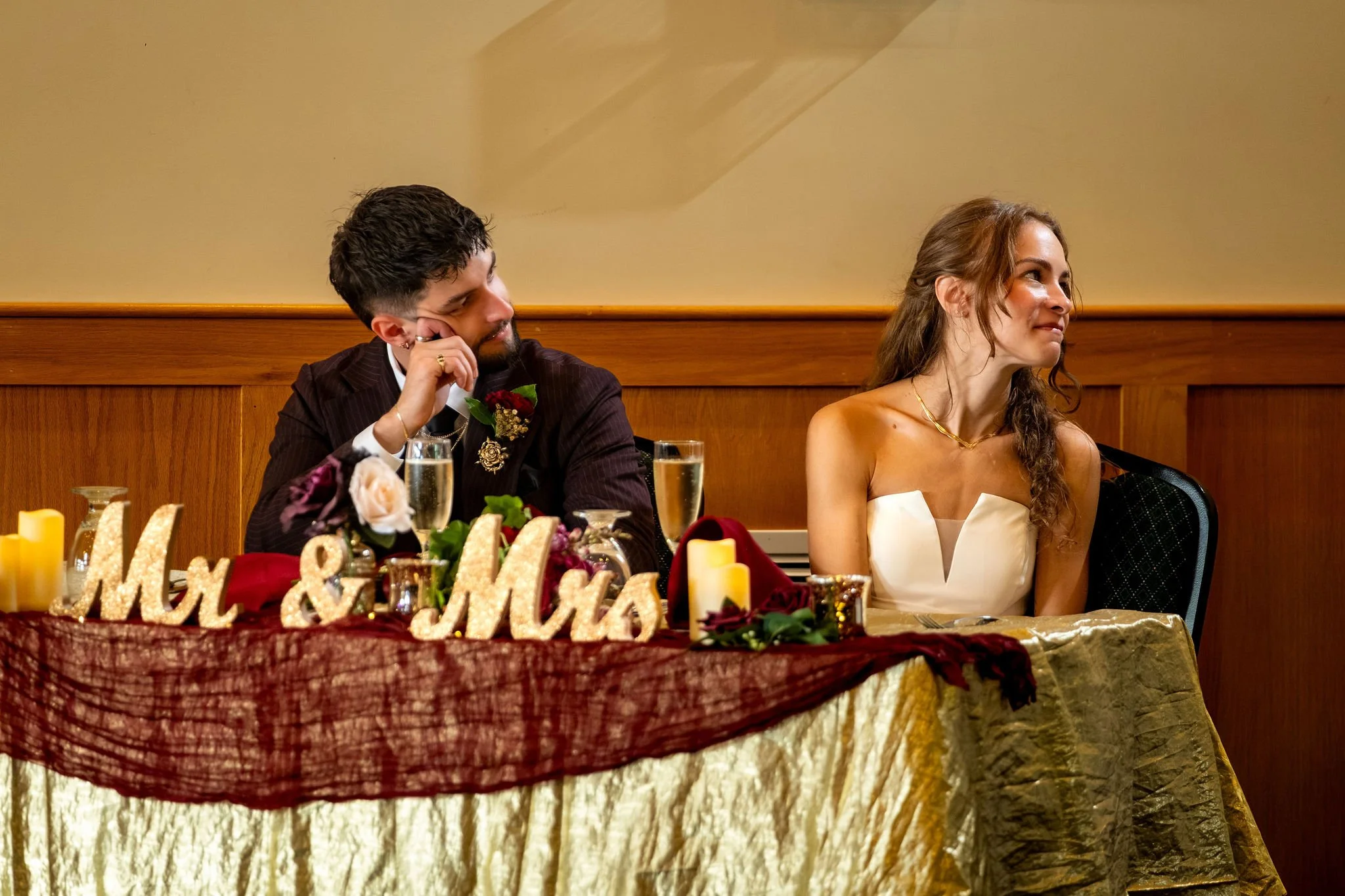 Cassidy and Chase Begin reacting to the speeches from the head table at Maple Hill Farm Inn and Conference Center in Hallowell Maine summer wedding photography VMG Productions