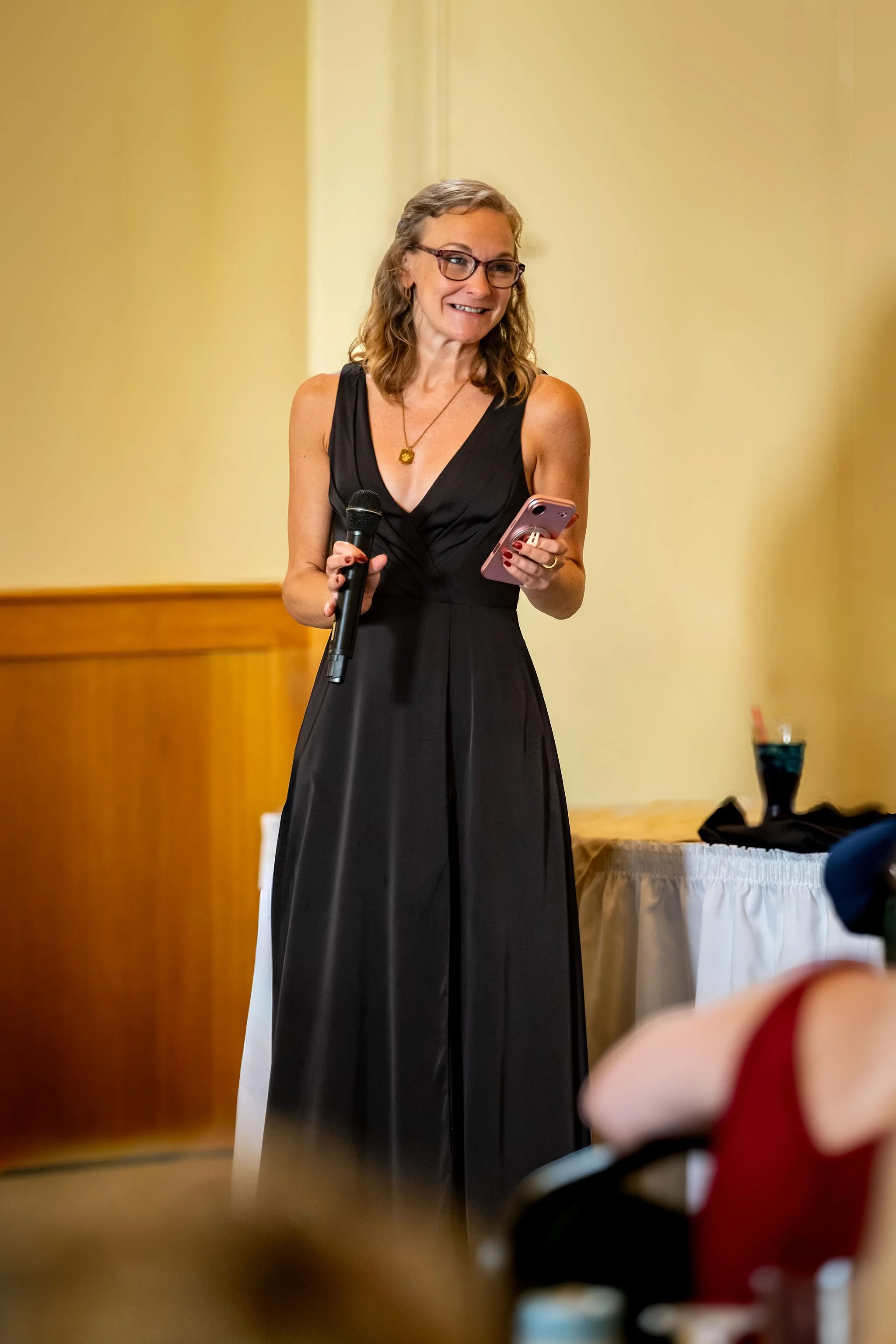The maid of honor giving her speech at Cassidy and Chase Begin's reception at Maple Hill Farm Inn and Conference Center in Hallowell Maine summer wedding photography VMG Productions