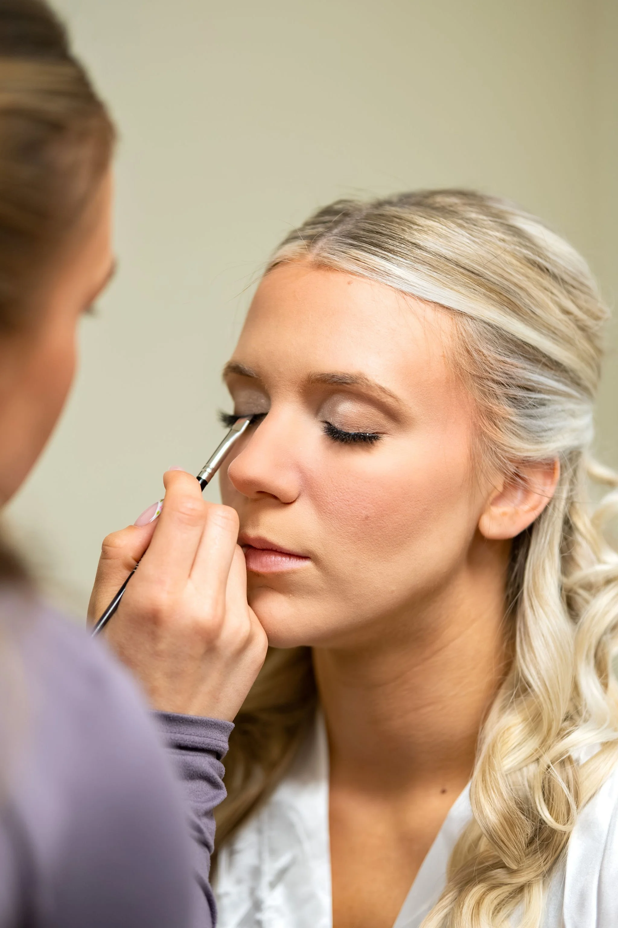 Jeremiah and Vienna tight bridal beauty portrait during makeup finishing touches at Holy Trinity Greek Orthodox Church Portland Maine spring wedding photography VMG Productions