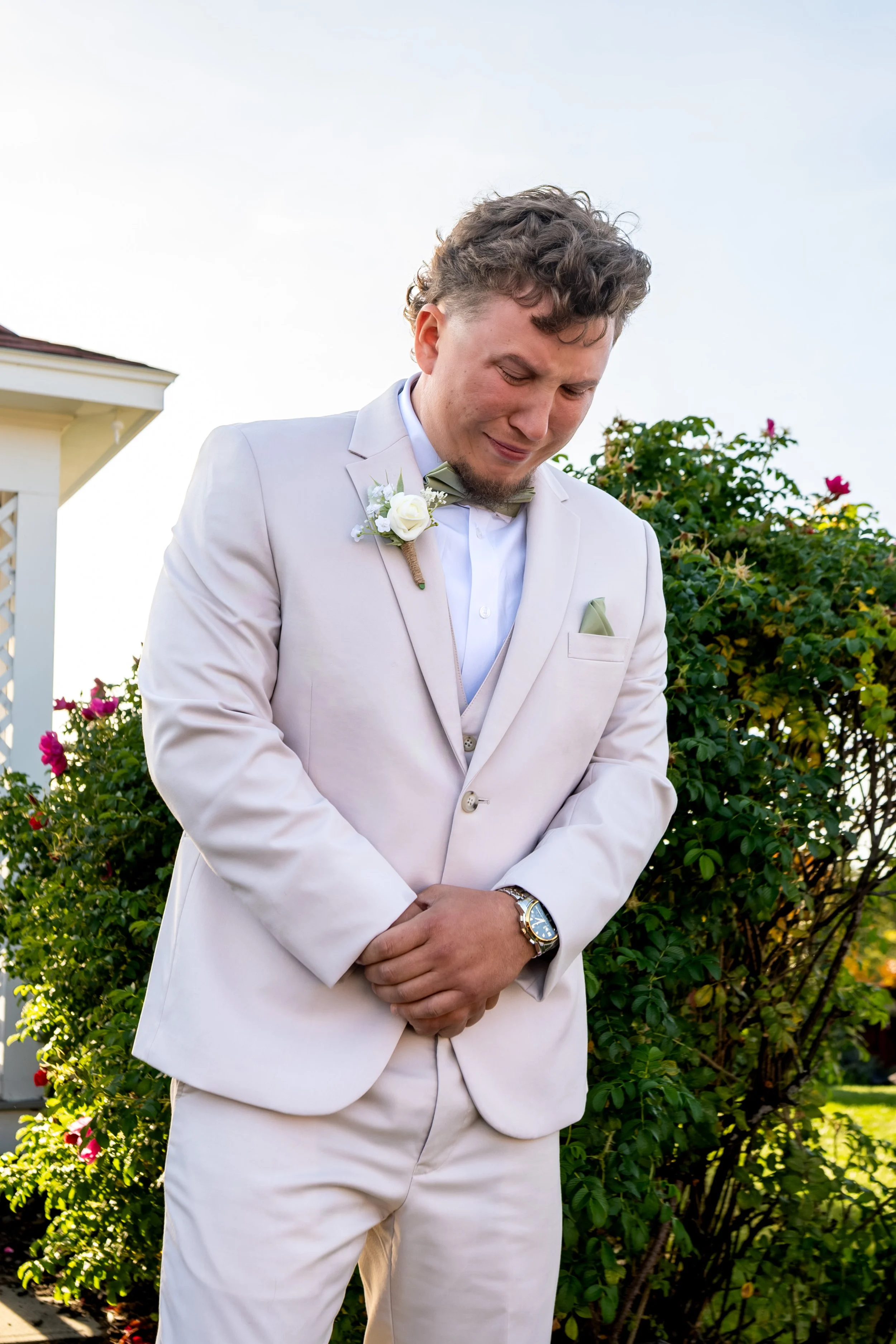 Andrew looking down with tears in his eyes as he waits at the front of the aisle at the Maine Wedding Barn and Event Center in Minot Maine fall wedding photography VMG Productions