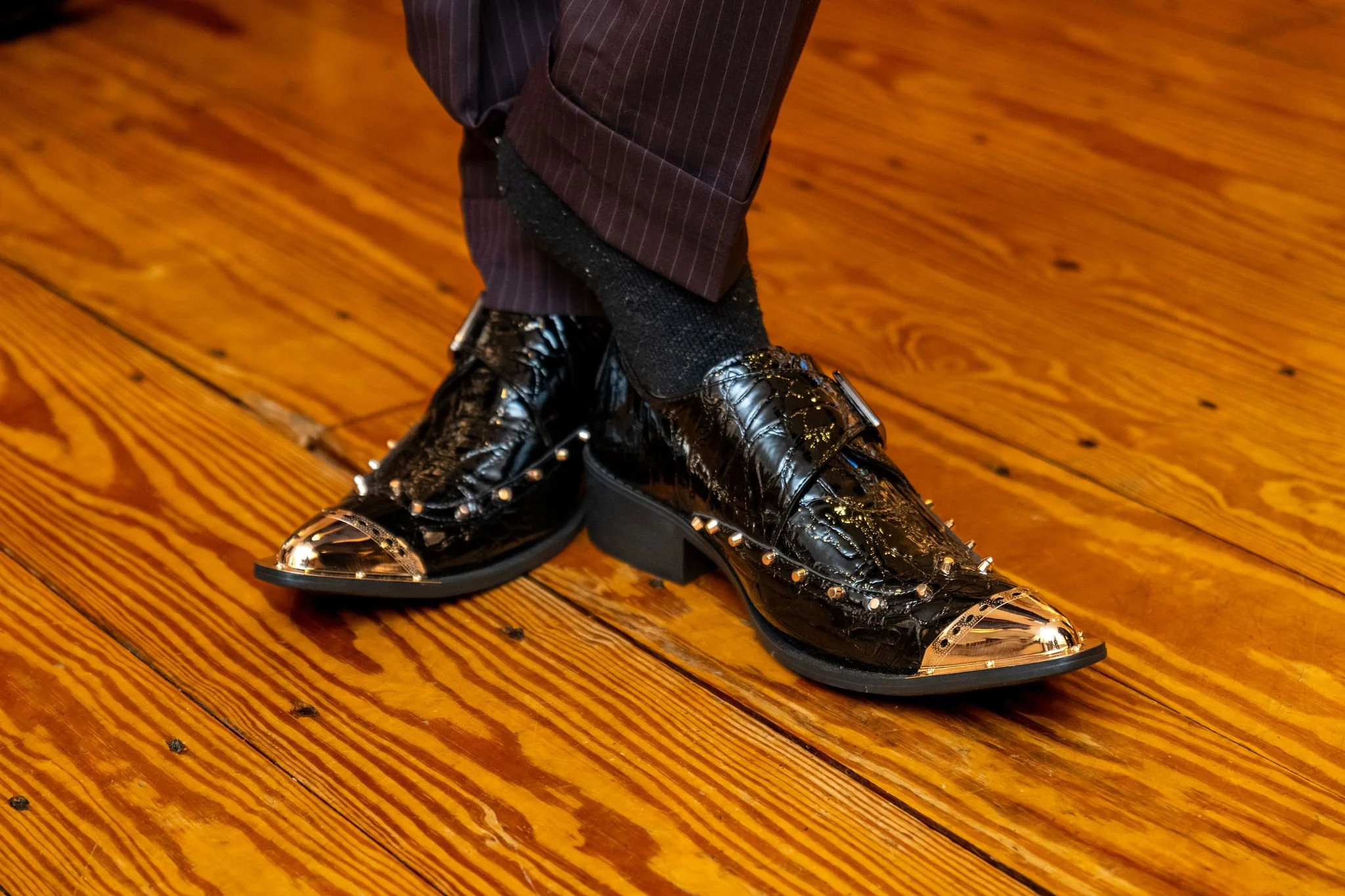Chase Begin's black gold-toed dress boots on the wood floor at Maple Hill Farm Inn and Conference Center in Hallowell Maine summer wedding photography VMG Productions