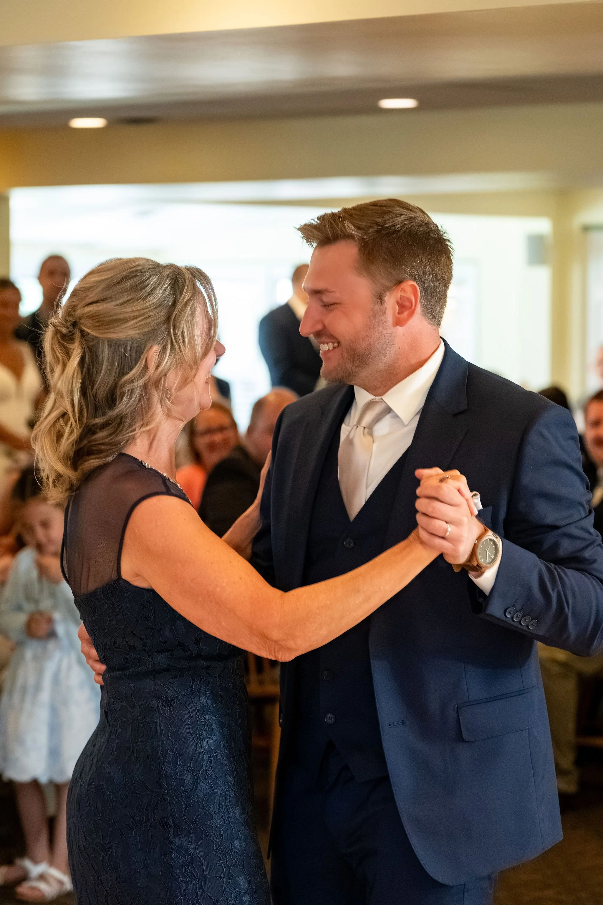 Beth and Cameron groom dancing with his mother at the reception at Augusta Country Club Manchester Maine spring wedding photography VMG Productions