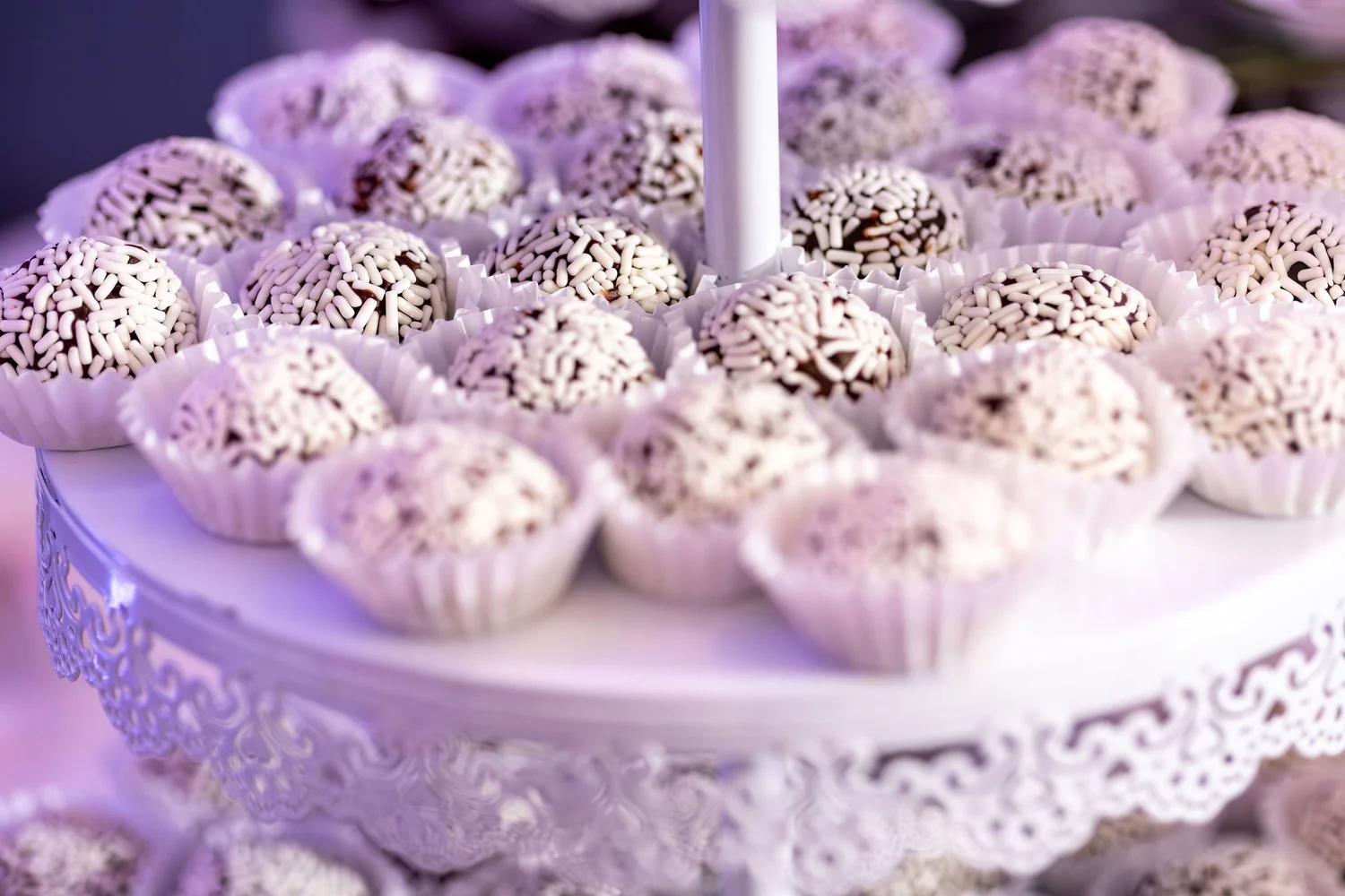 Brigadeiros rolled in sprinkles on a lace cake stand at Portland Sheraton at Sable Oaks South Portland Maine summer wedding photography VMG Productions