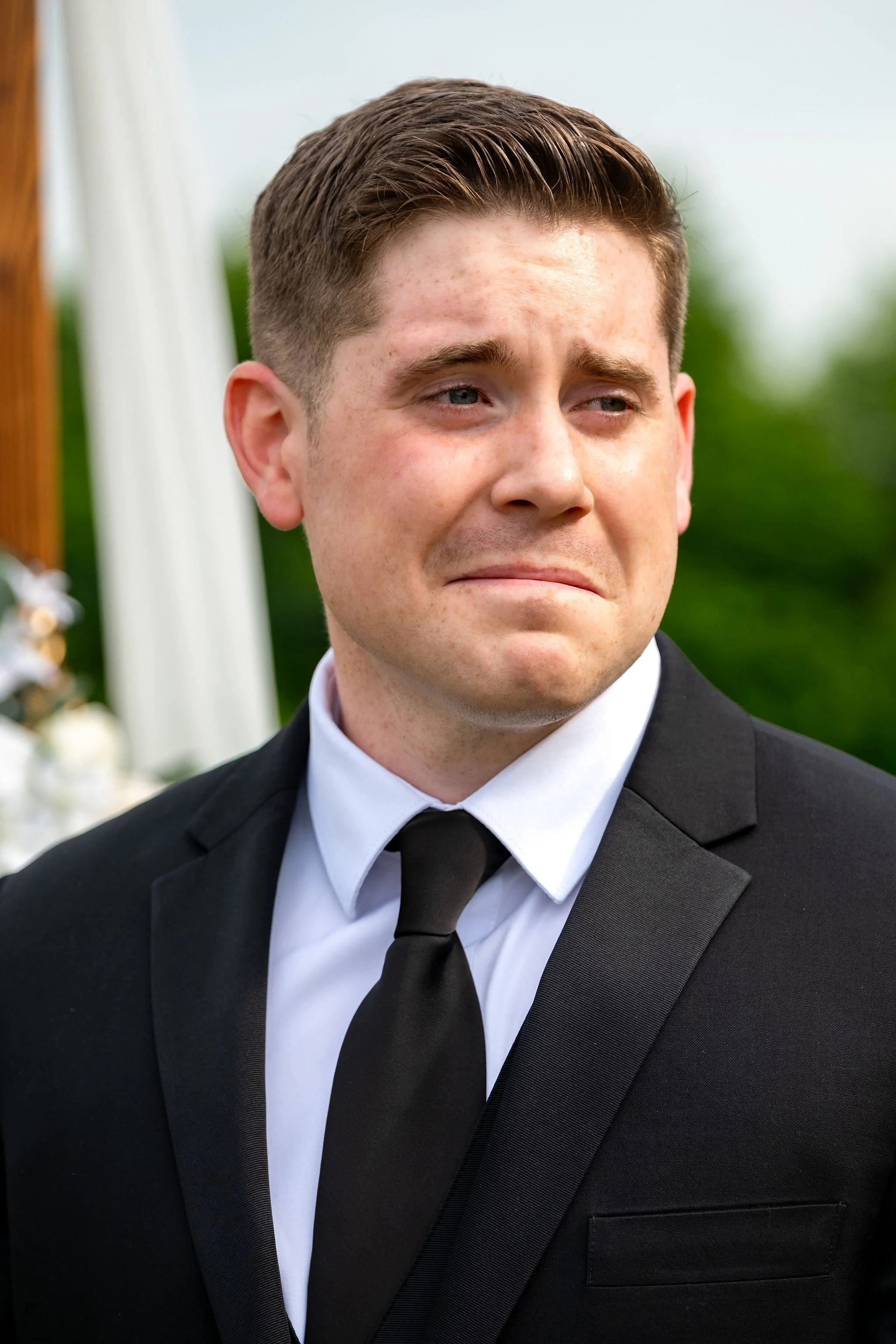 Ethan DeAngelis emotional reaction watching Kayla walk down the aisle at their Sanbornton New Hampshire backyard wedding photography VMG Productions
