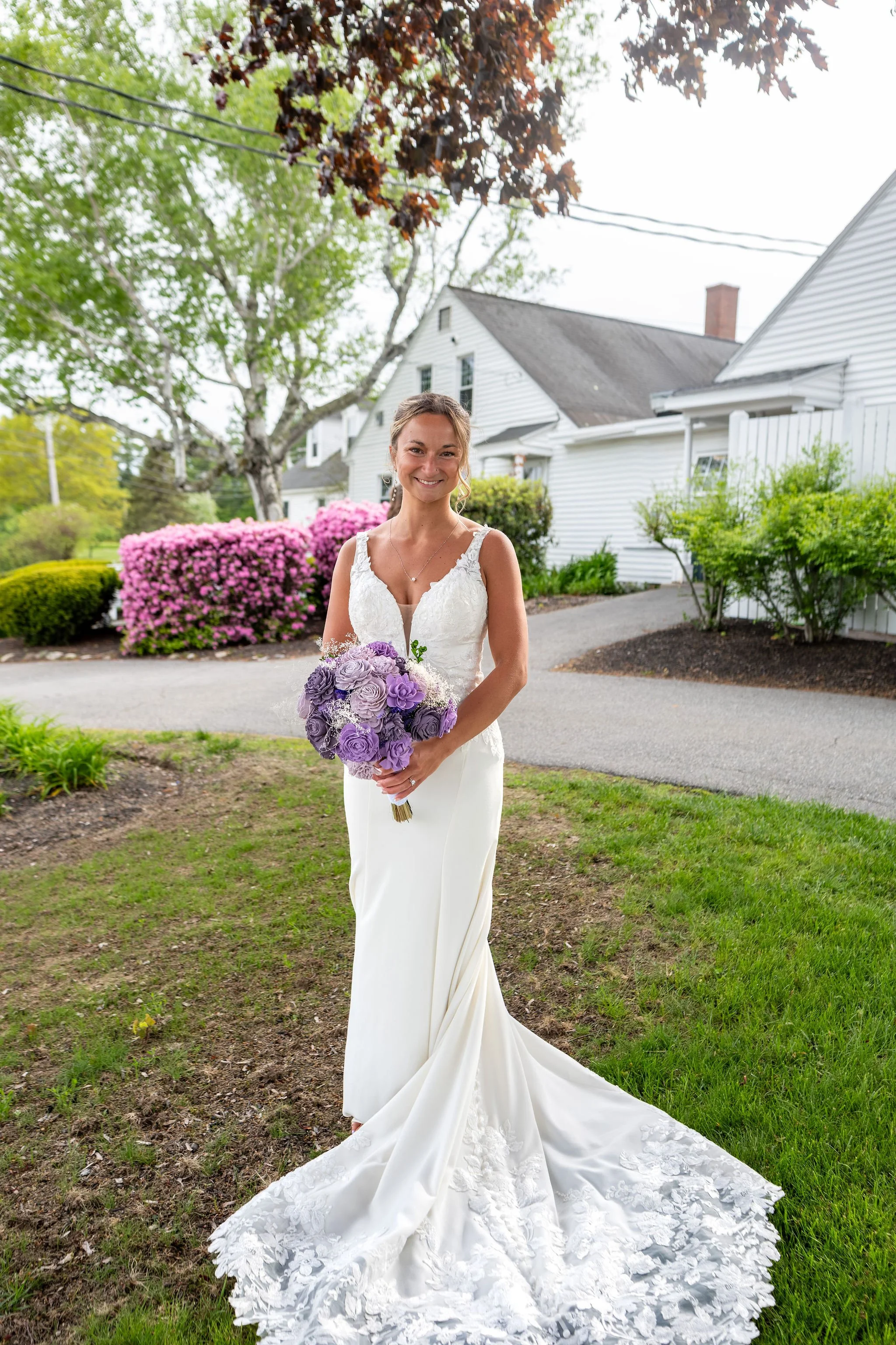 Beth and Cameron full length bridal portrait with lavender bouquet at Augusta Country Club Manchester Maine spring wedding photography VMG Productions
