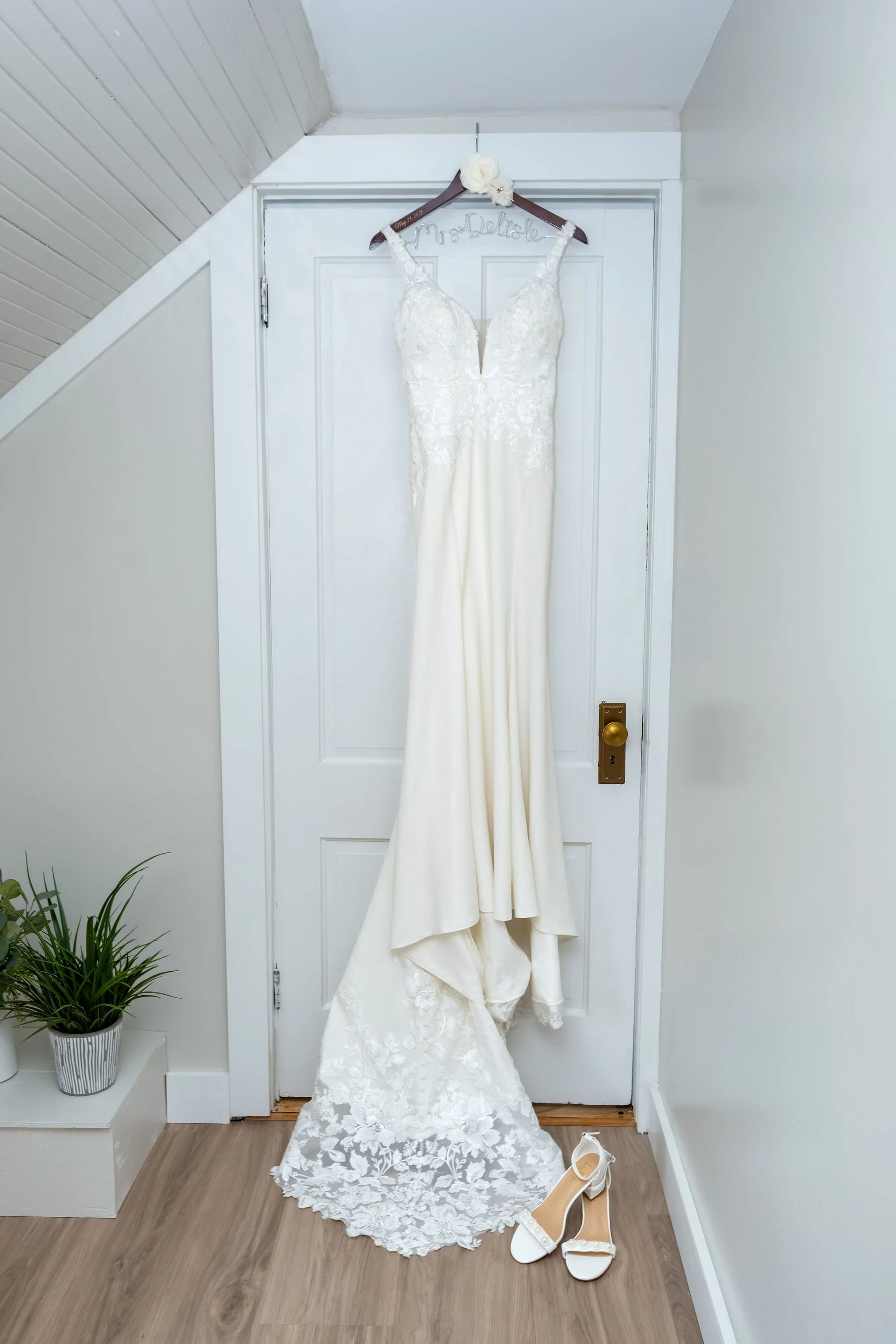 Beth and Cameron the bride's gown and shoes hanging before the ceremony at Augusta Country Club Manchester Maine spring wedding photography VMG Productions