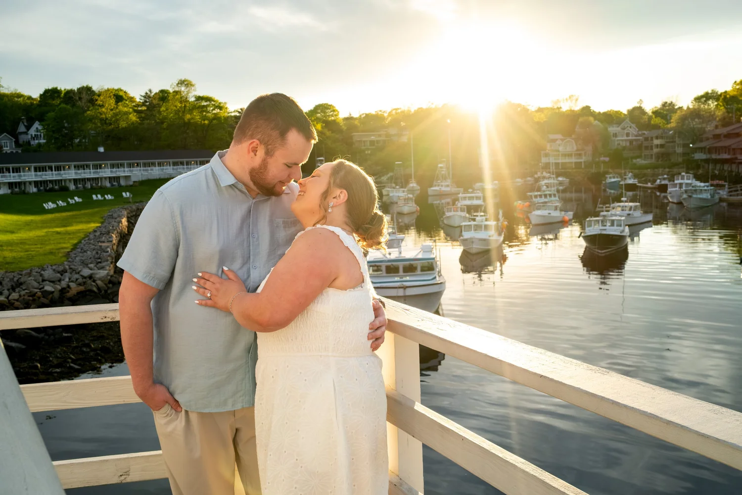 Couple at the railing at golden hour over Perkins Cove harbor, Ogunquit, Maine, by VMG Productions