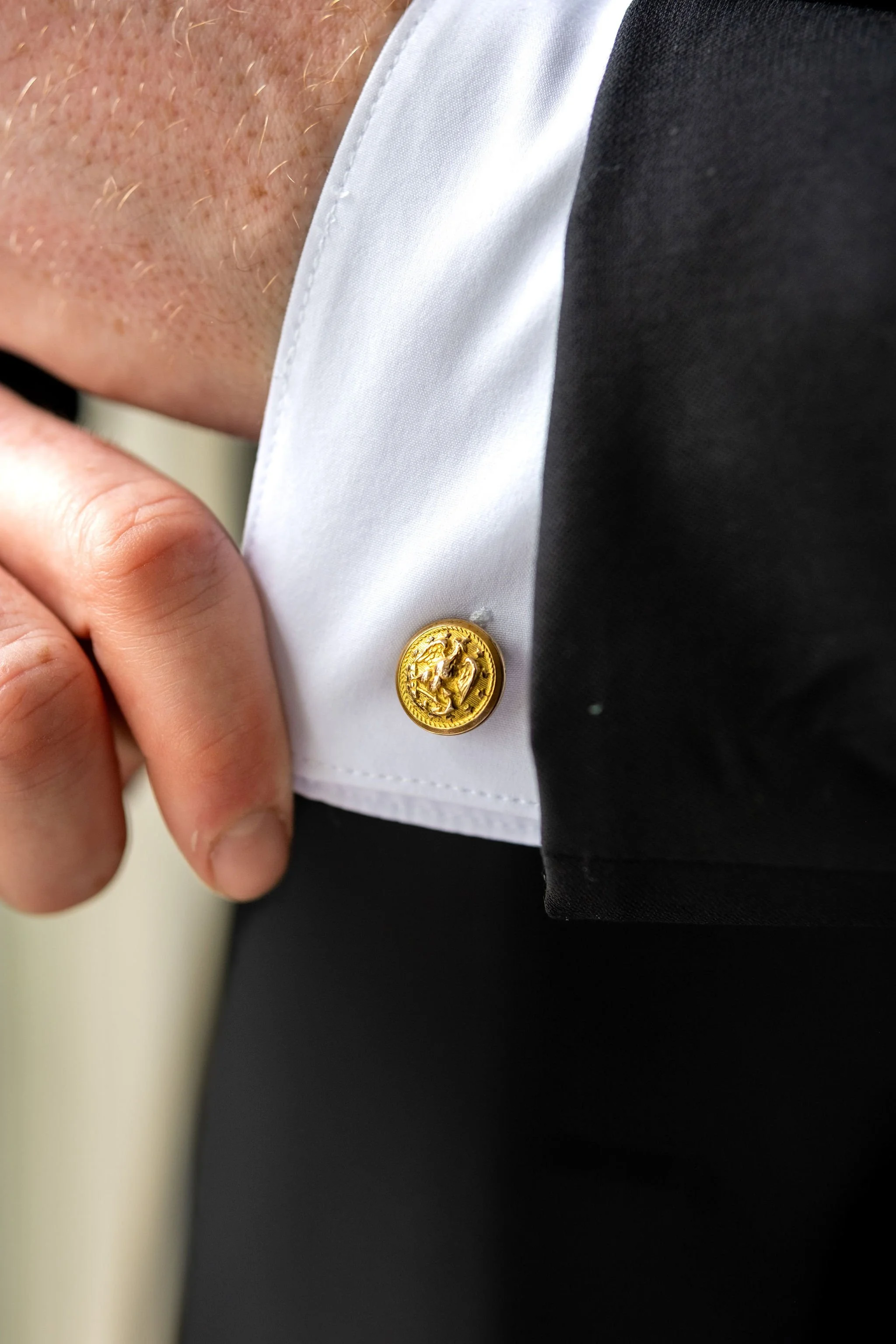 Ethan DeAngelis gold cufflink detail on his wedding day at Lake Winnisquam Belmont New Hampshire summer wedding photography VMG Productions