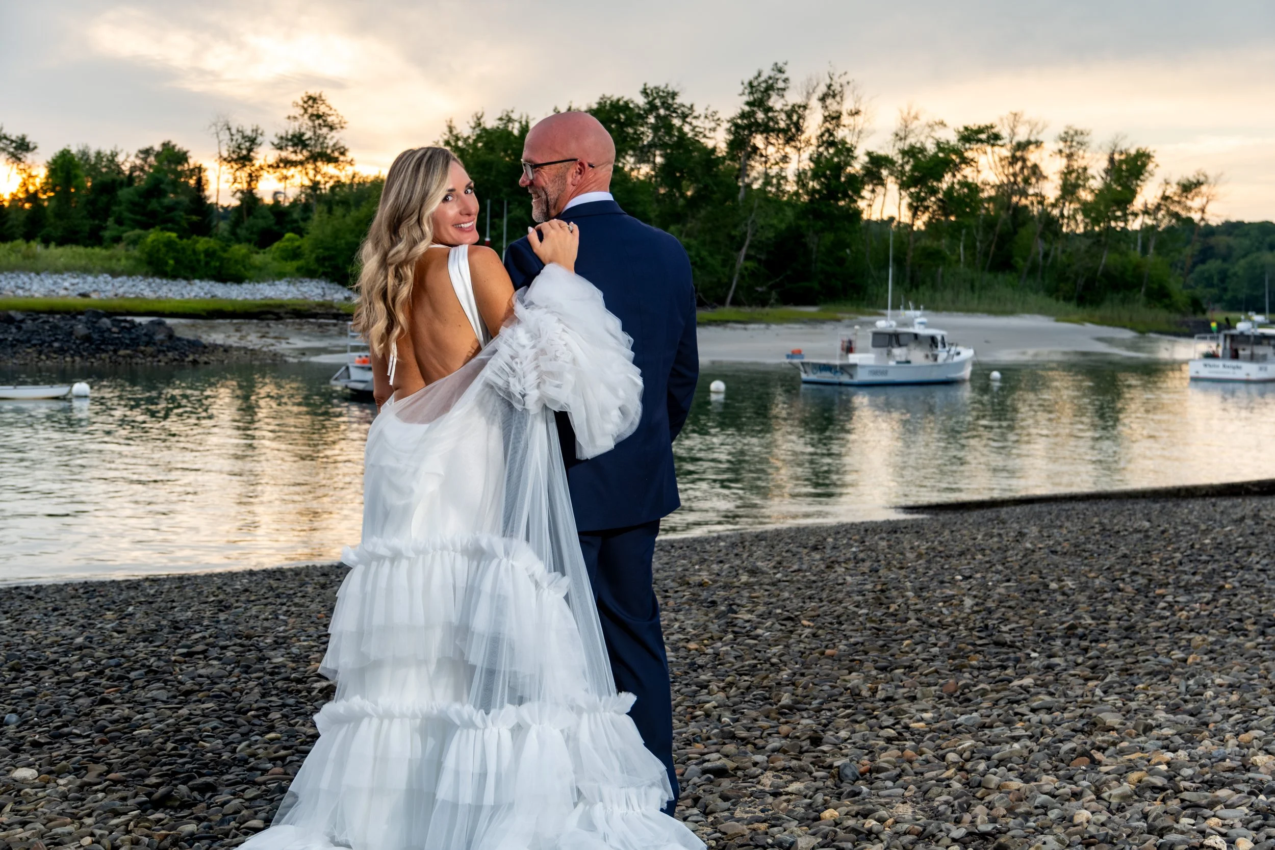 Ashley and Marc Draper embracing on the beach at golden hour at The Breakwater Inn in Kennebunkport Maine summer wedding photography VMG Productions
