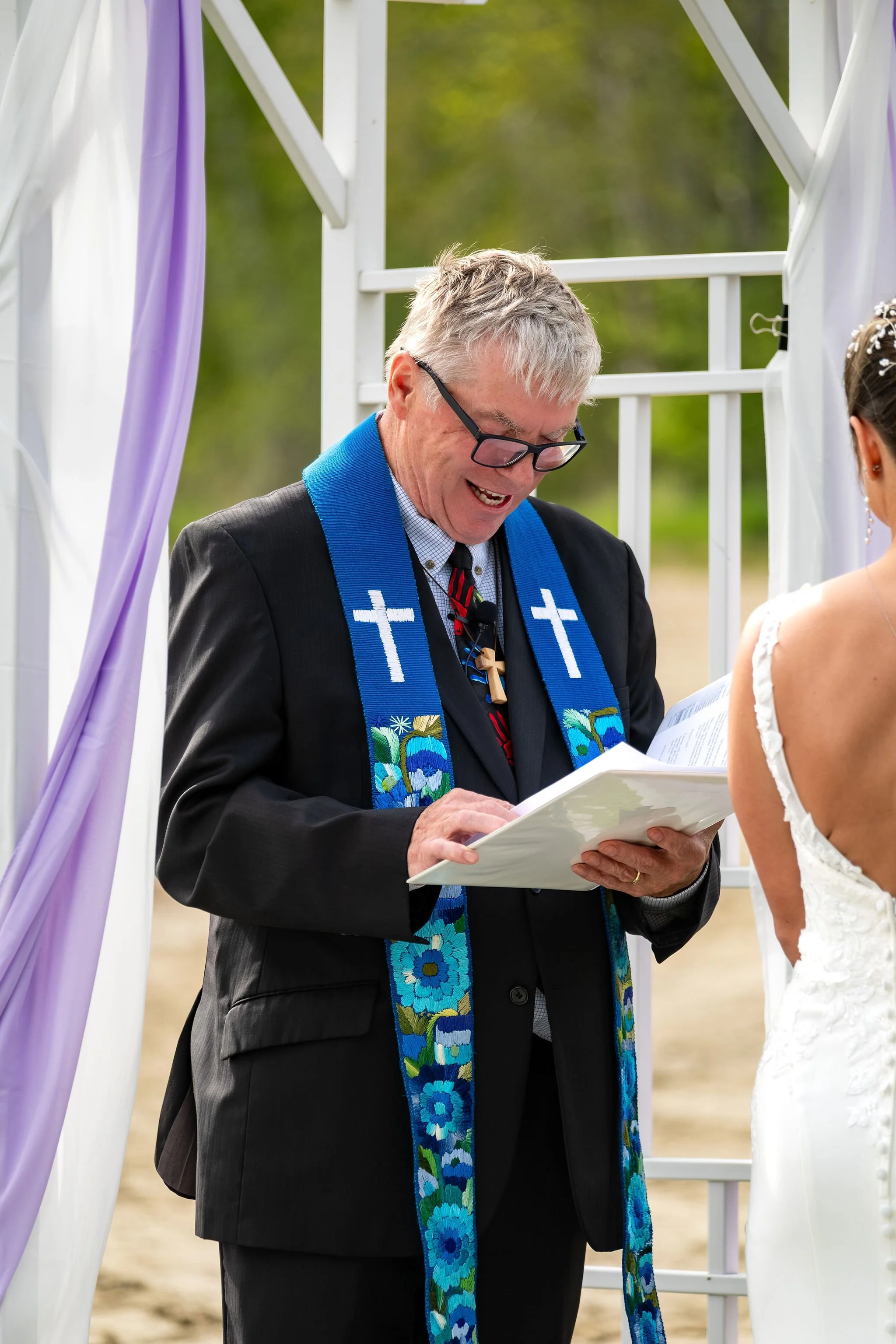 Beth and Cameron officiant leading the lakeside ceremony at Augusta Country Club Manchester Maine spring wedding photography VMG Productions