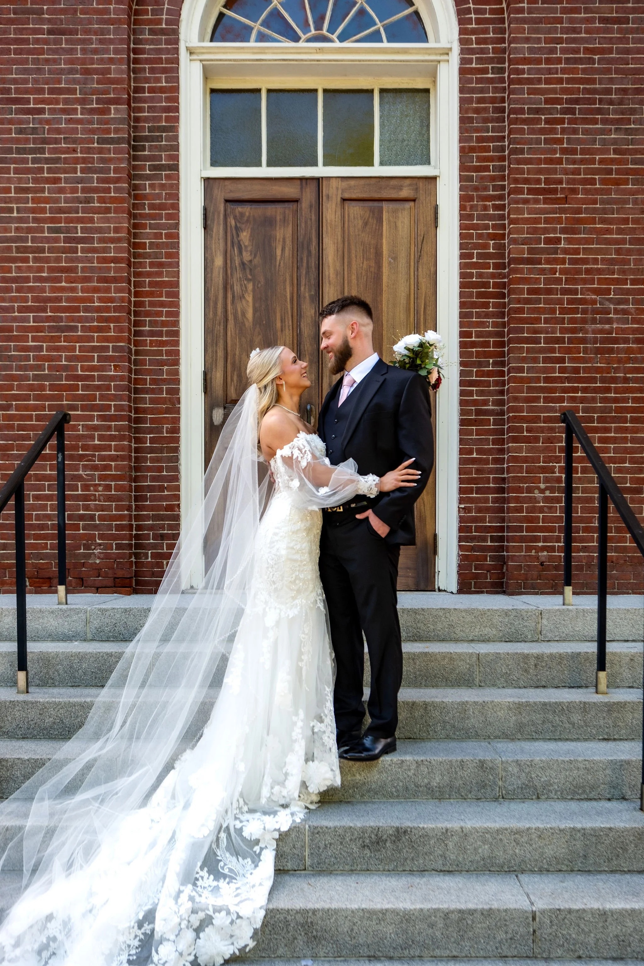 Jeremiah and Vienna relaxed portrait with natural smiles and strong connection at Holy Trinity Greek Orthodox Church Portland Maine spring wedding photography VMG Productions