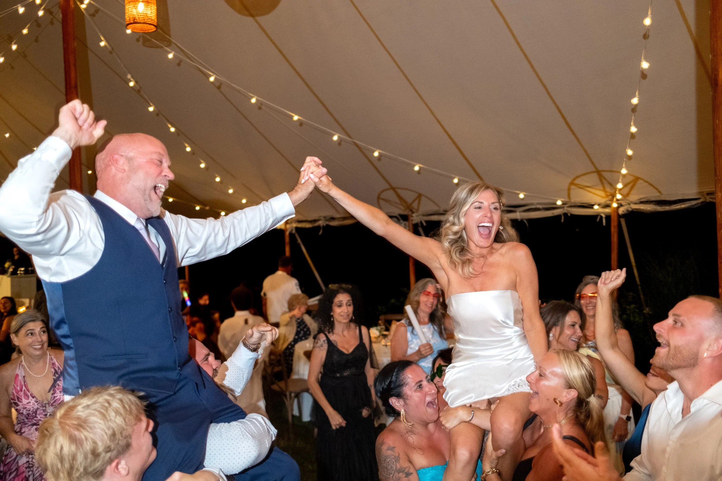 Ashley dancing with Marc in the middle of the packed dance floor in her second dress at The Breakwater Inn in Kennebunkport Maine summer wedding photography VMG Productions