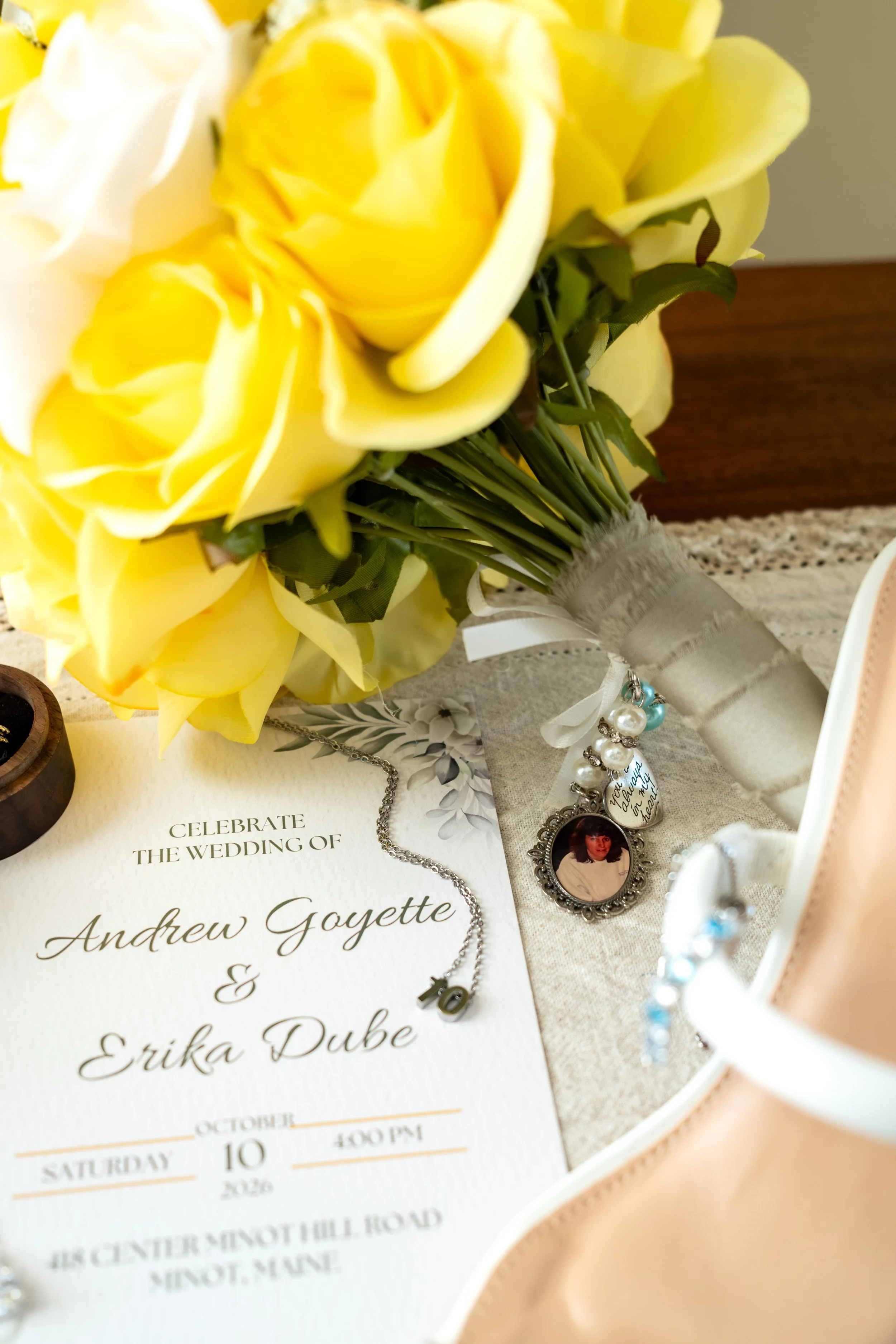 Close detail of yellow and white roses in Erika's bouquet at the Maine Wedding Barn and Event Center in Minot Maine fall wedding photography VMG Productions