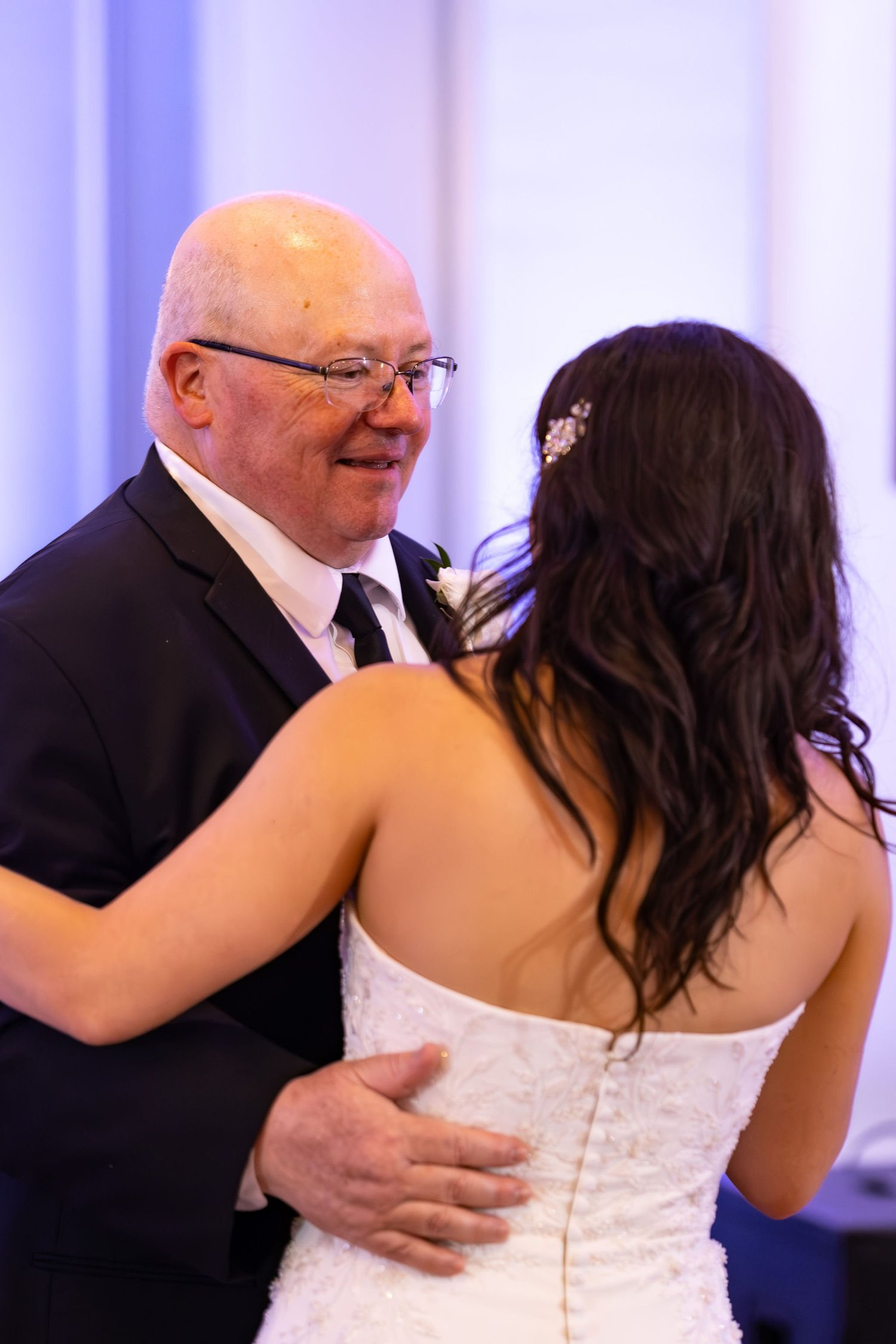 Alexey dancing with his mother beneath the monogram at Portland Sheraton at Sable Oaks South Portland Maine summer wedding photography VMG Productions