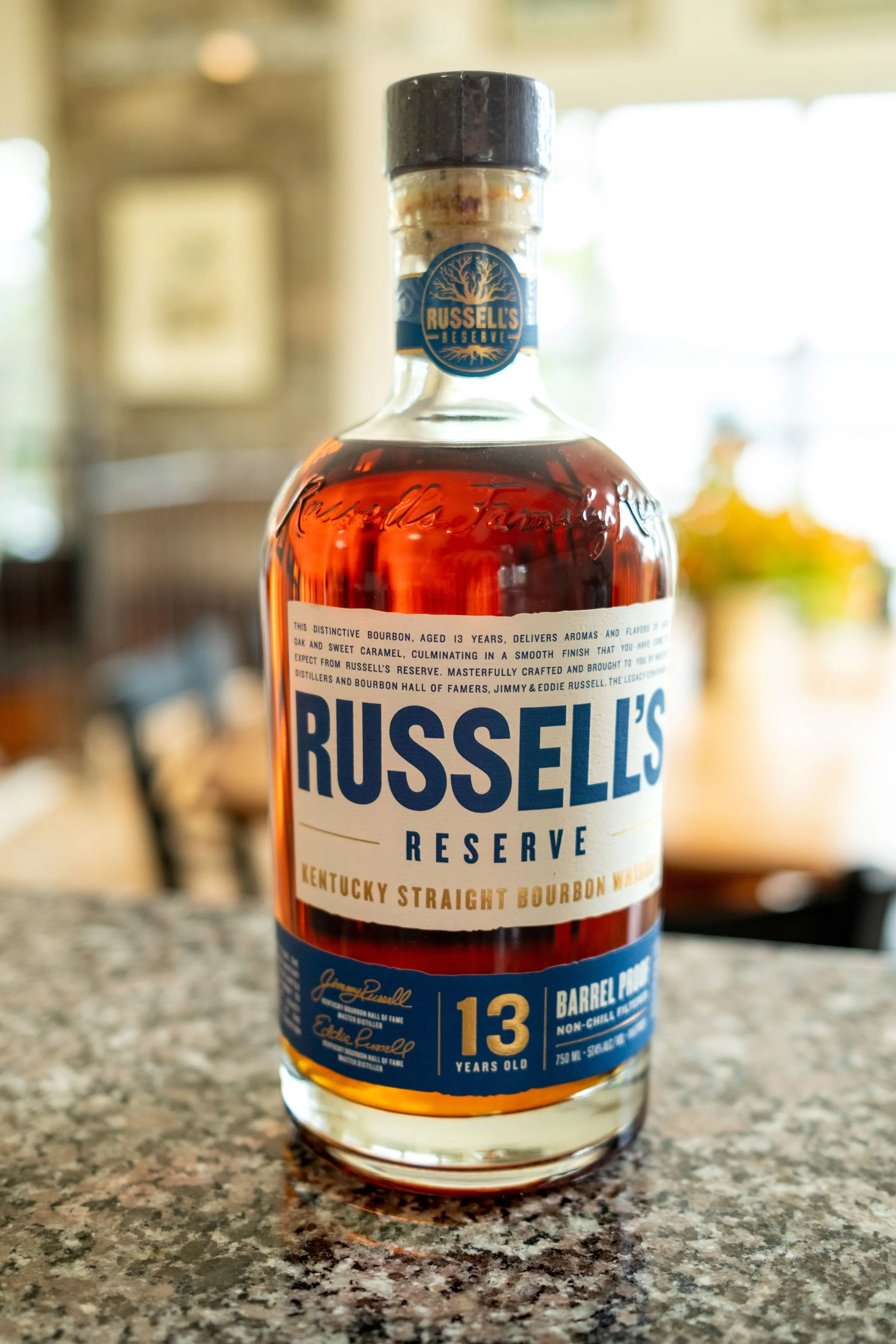 Bottle of thirteen year bourbon as a groom detail at Alli and Adam Baudoin's Mount Desert Maine spring wedding photography VMG Productions