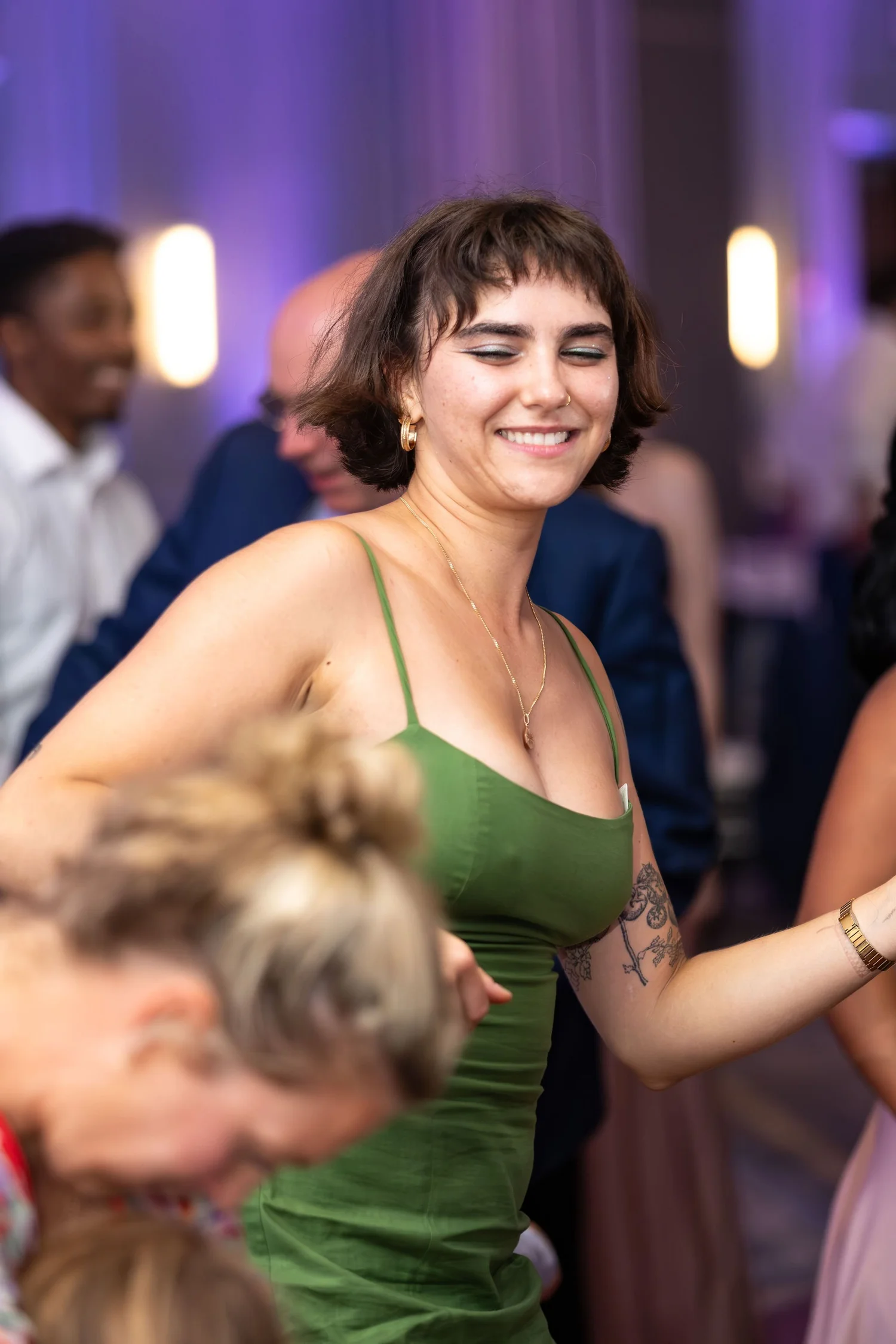 Guests of all ages pulled into the group dance at Portland Sheraton at Sable Oaks South Portland Maine summer wedding photography VMG Productions