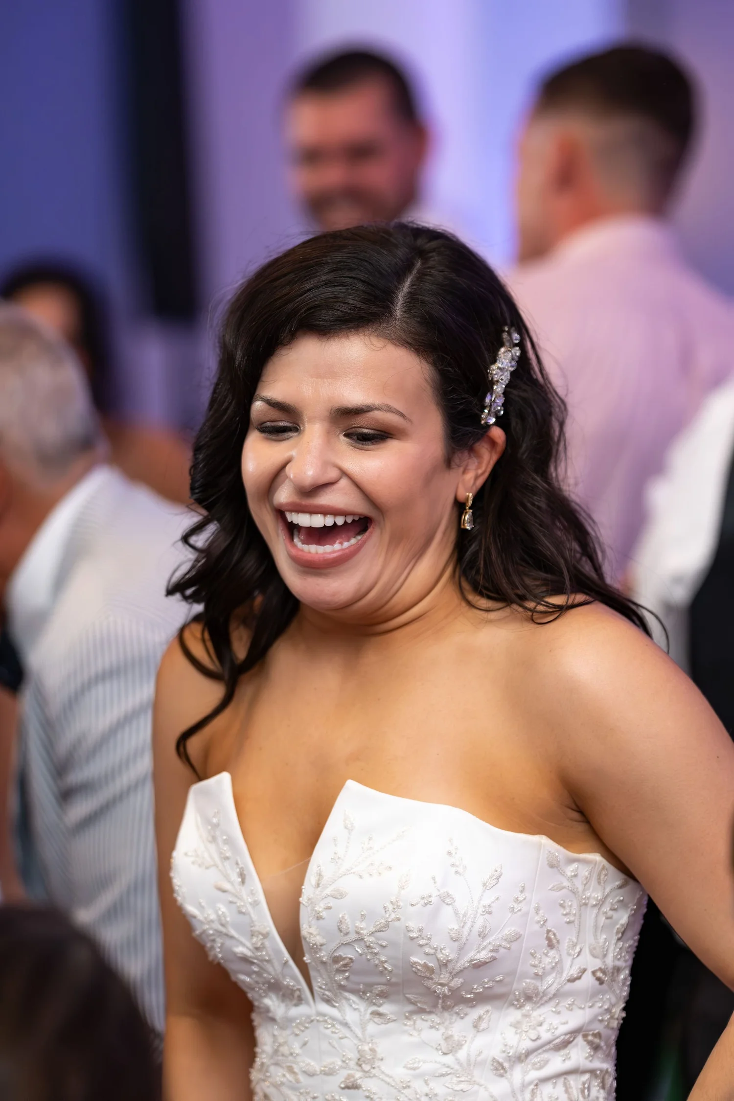 A guest singing along on the dance floor at Portland Sheraton at Sable Oaks South Portland Maine summer wedding photography VMG Productions