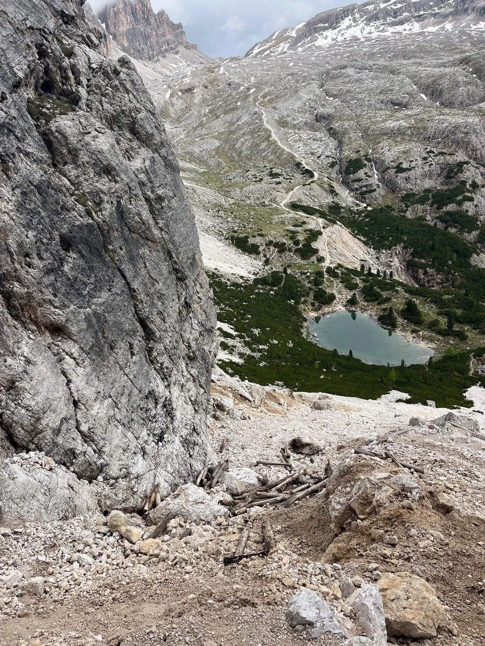 Early-season snow on the Alta Via 1 trail near Forcella di Lago