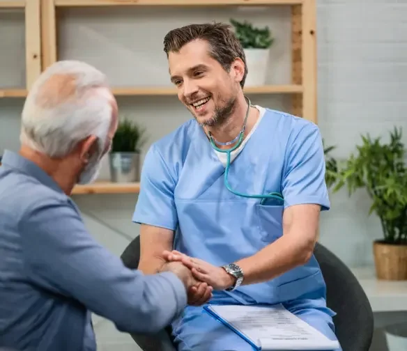Car accident doctor serving Guthrie, Oklahoma consulting with senior male patient