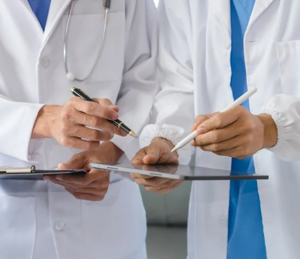 Car accident doctors in Classen-Ten-Penn OKC filling out medical forms