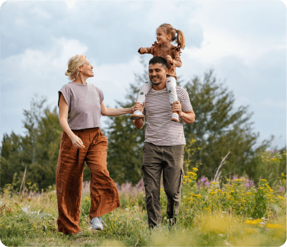 Happy family walking outdoors indicating comfort and ease after successful Oklahoma City pain management treatment
