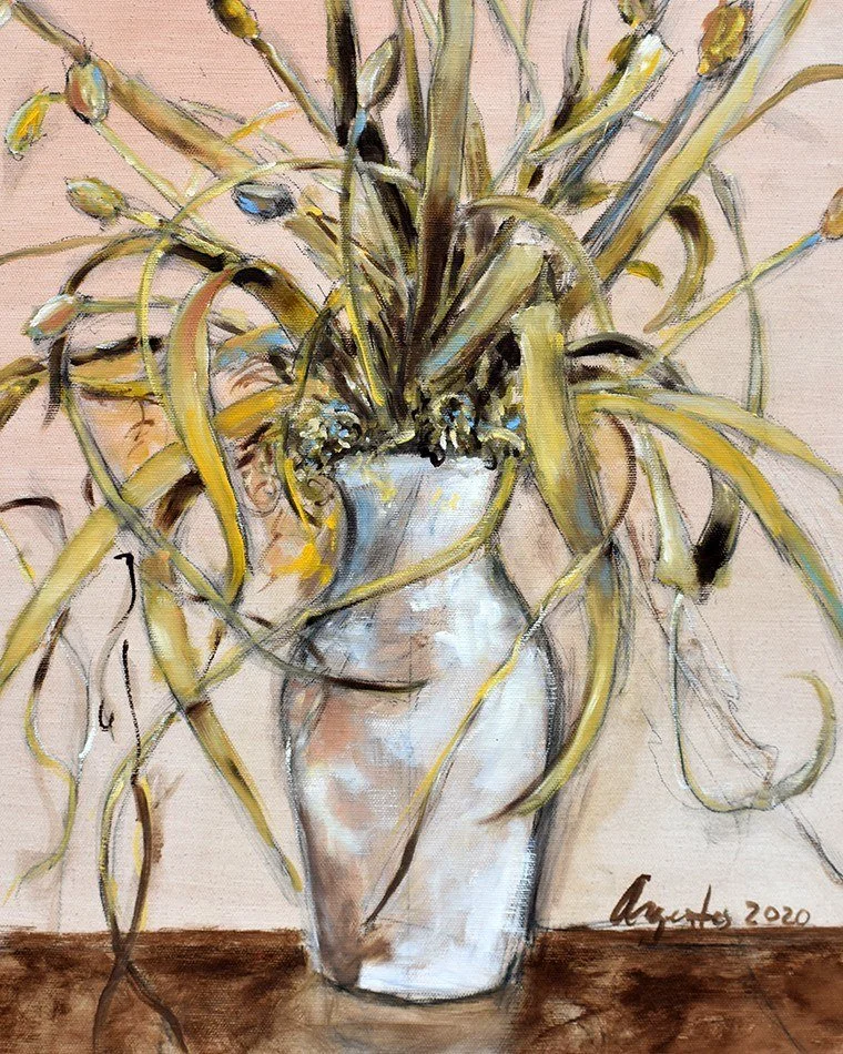 Close-up of Frank Argento’s Dry Bouquet: dried golden stems and buds spilling from a white vase on a brown table (detail view)