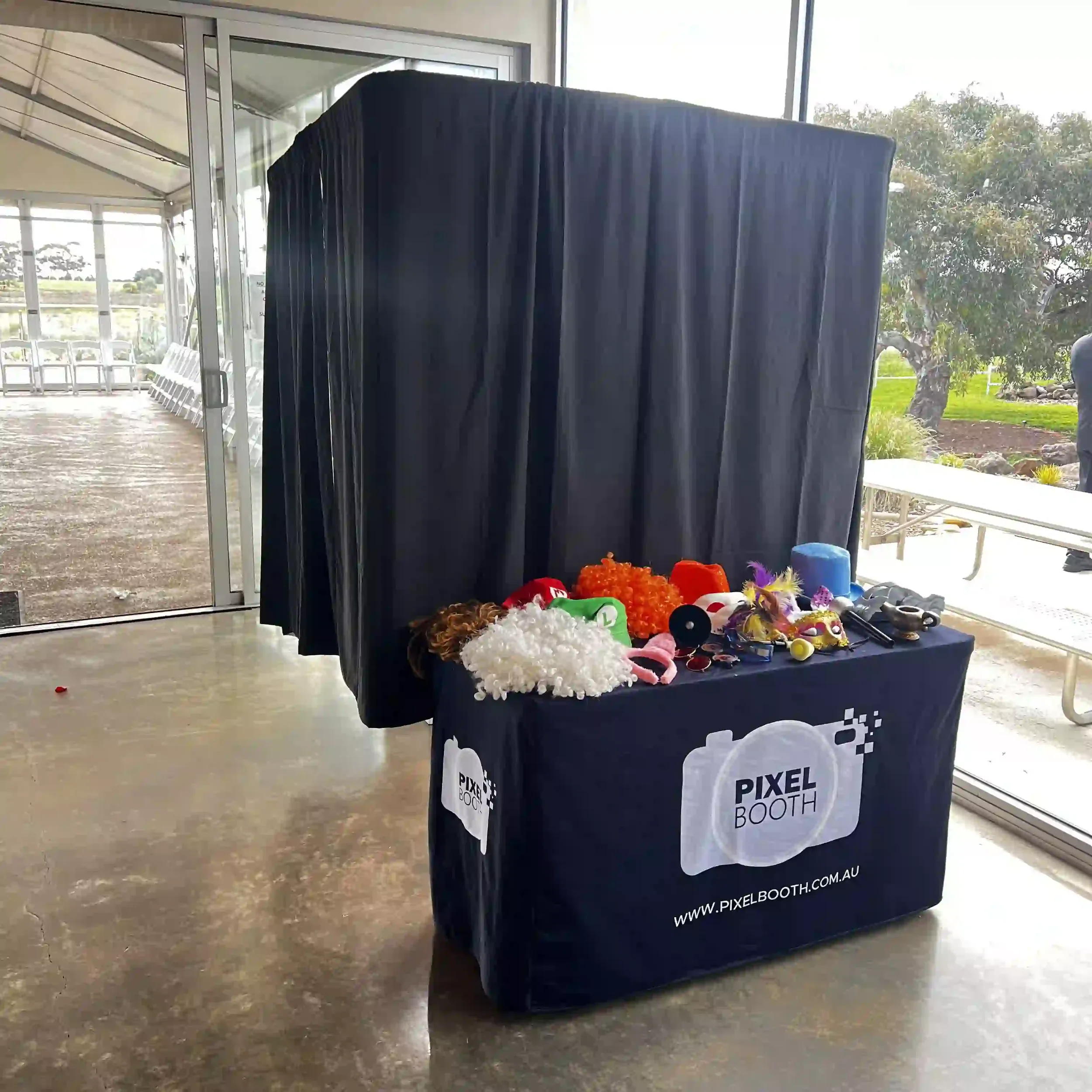 Classic curtain enclosed photo booth hire Melbourne setup with choice of curtain colour
