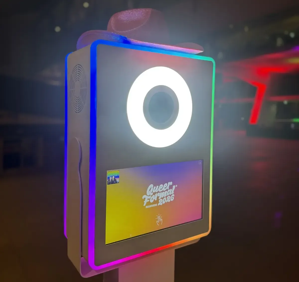 Pixel Booth photo booth displaying a custom Queer Formal start screen with LED lighting set to Pride colours