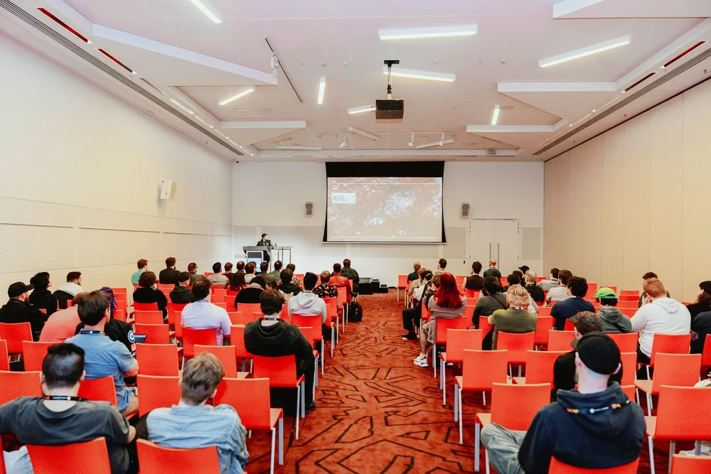 Conference session room set for GCAP delegates in Melbourne