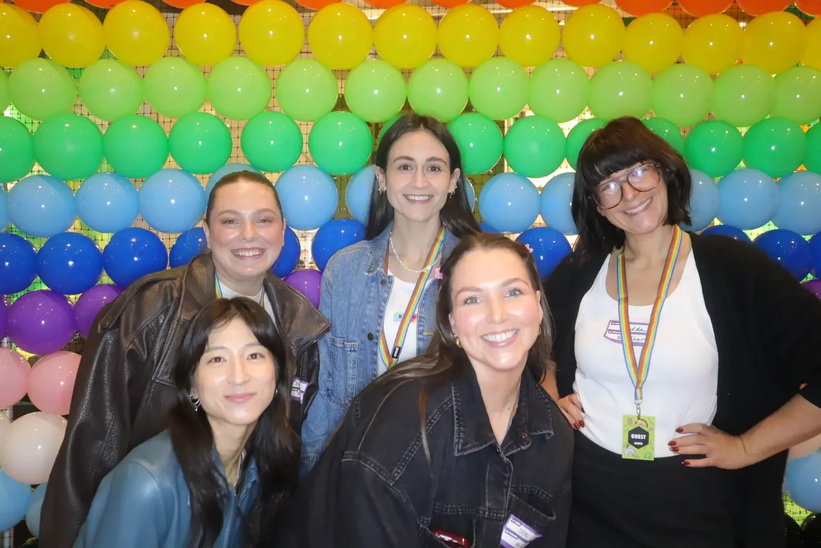 Bonds and Minus18 event team photographed in front of the Pride Balloon Wall at Queer Formal Melbourne