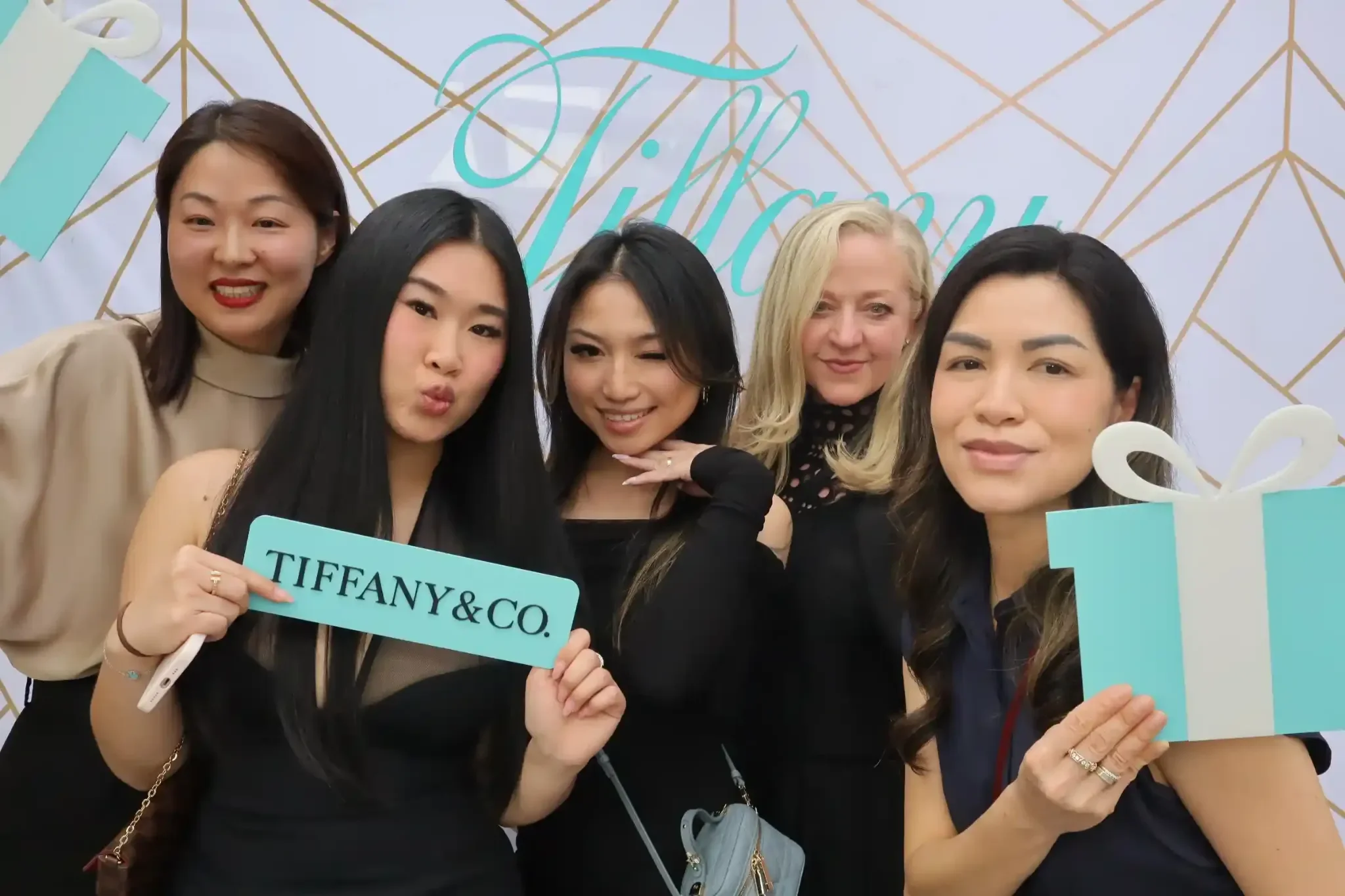 Affordable office party photo booth guests at Tiffany and Co themed corporate event