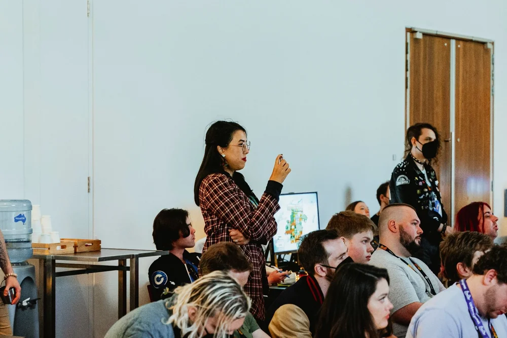Delegate asking a question during a GCAP Conference session in Melbourne