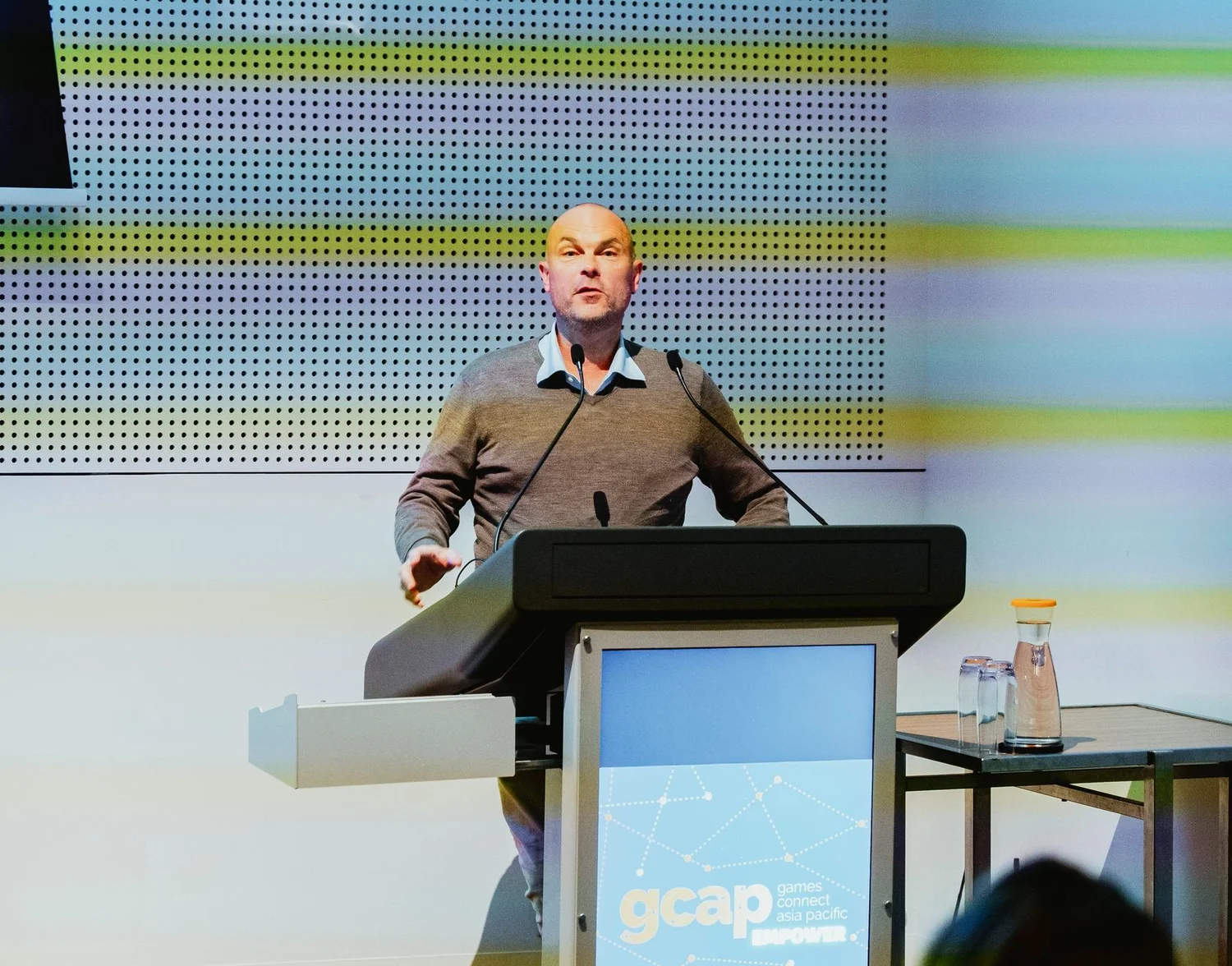 Session speaker on stage at GCAP Conference Melbourne
