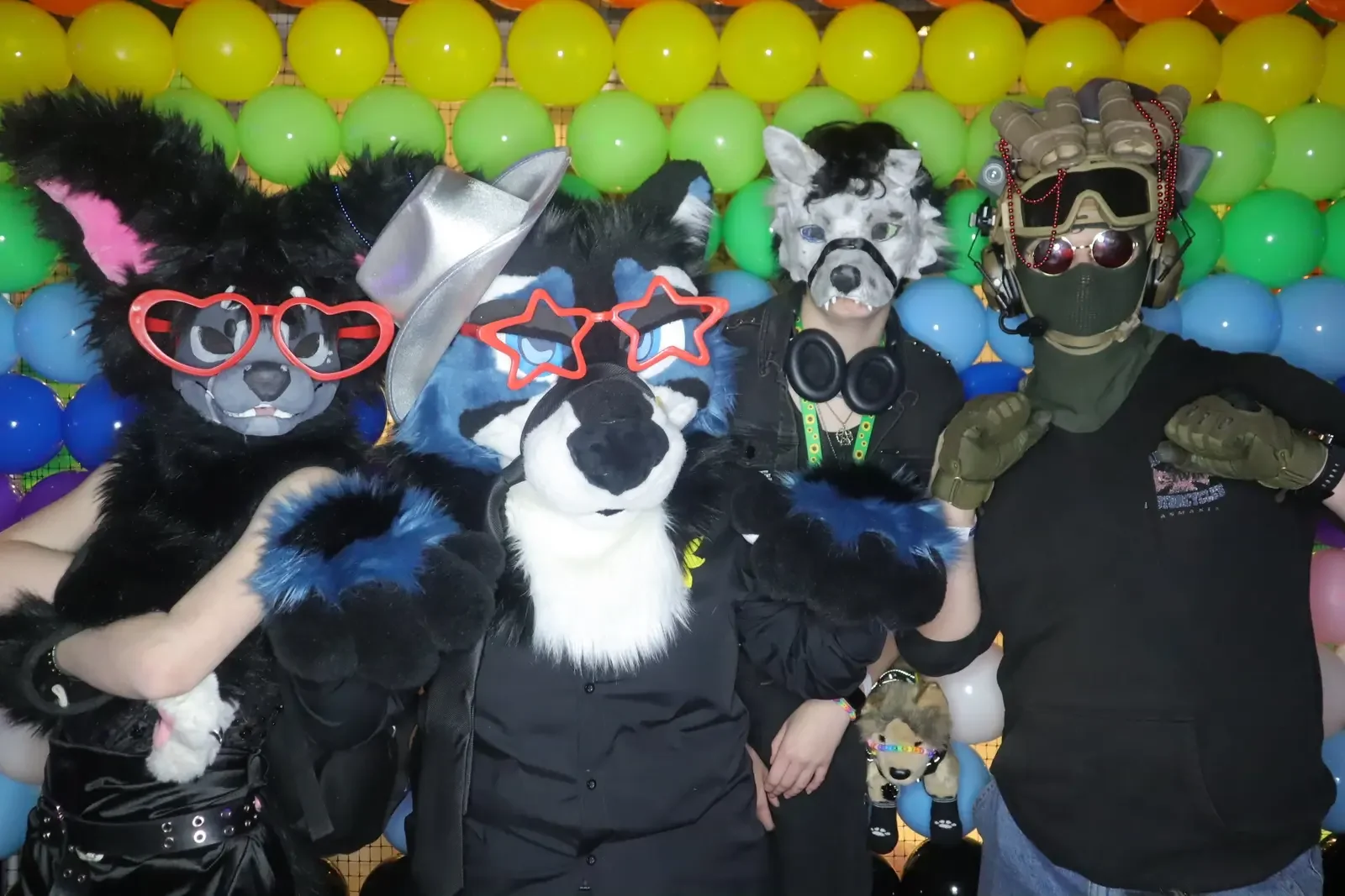 Costumed Queer Formal guests posing together for the Bonds and Minus18 Pride photo booth activation