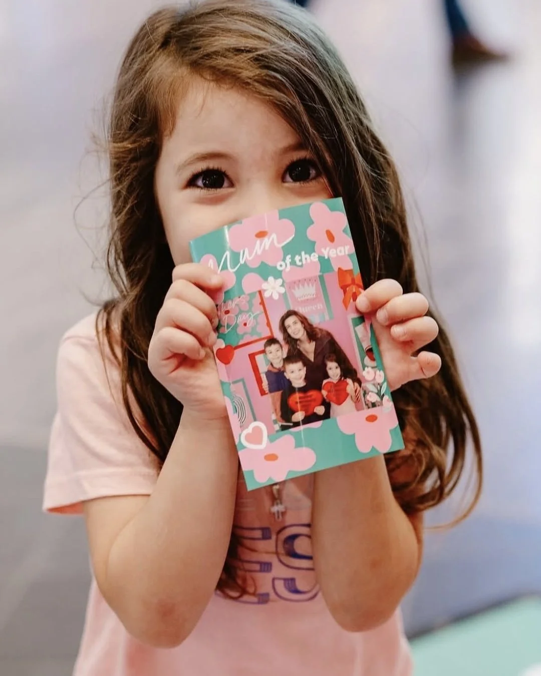 Child holding Mother’s Day printed photo keepsake from Westfield Knox activation