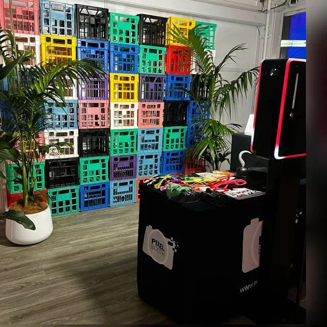 Custom colour crate wall built from stacked coloured milk crates as an event photo backdrop in Melbourne