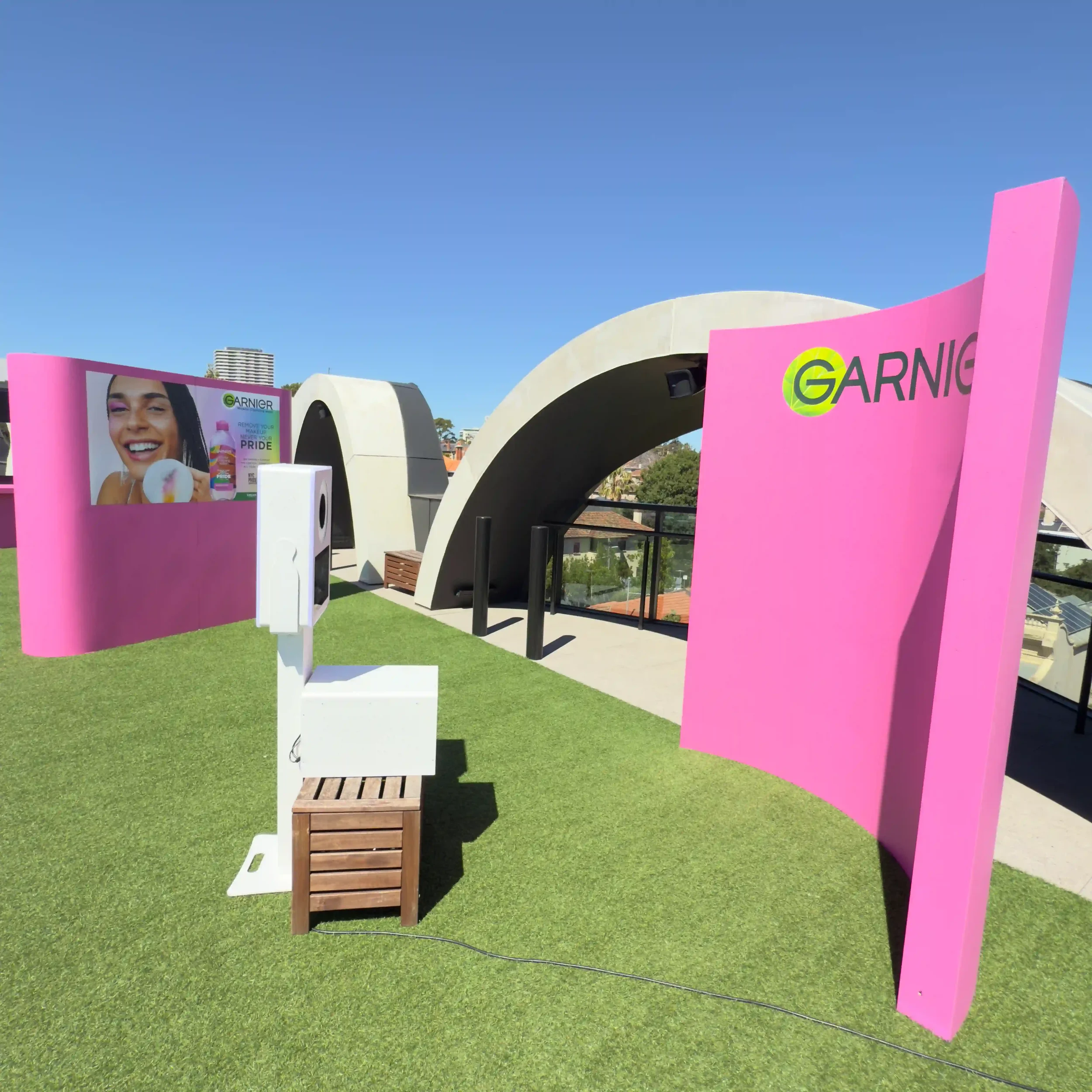 Garnier photo booth activation Melbourne with hot pink branded backdrop