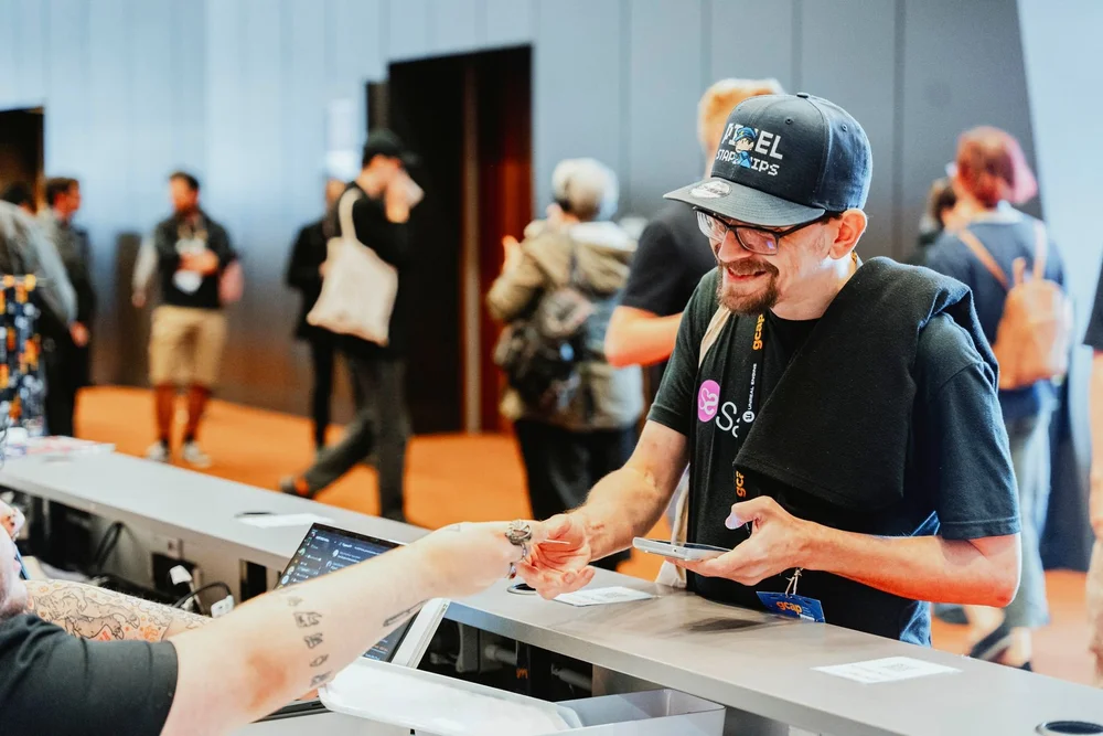 Delegate checking in at GCAP Conference registration in Melbourne