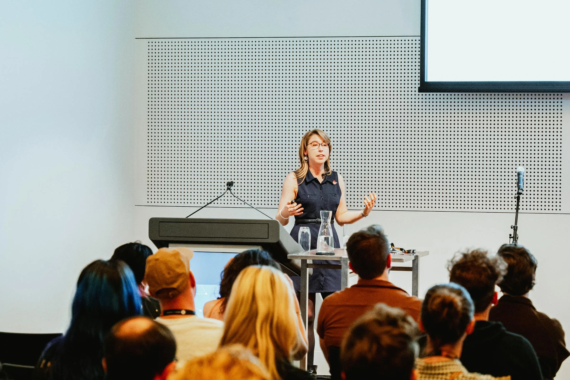 Keynote speaker on stage at GCAP Conference, Plaza Ballroom Melbourne