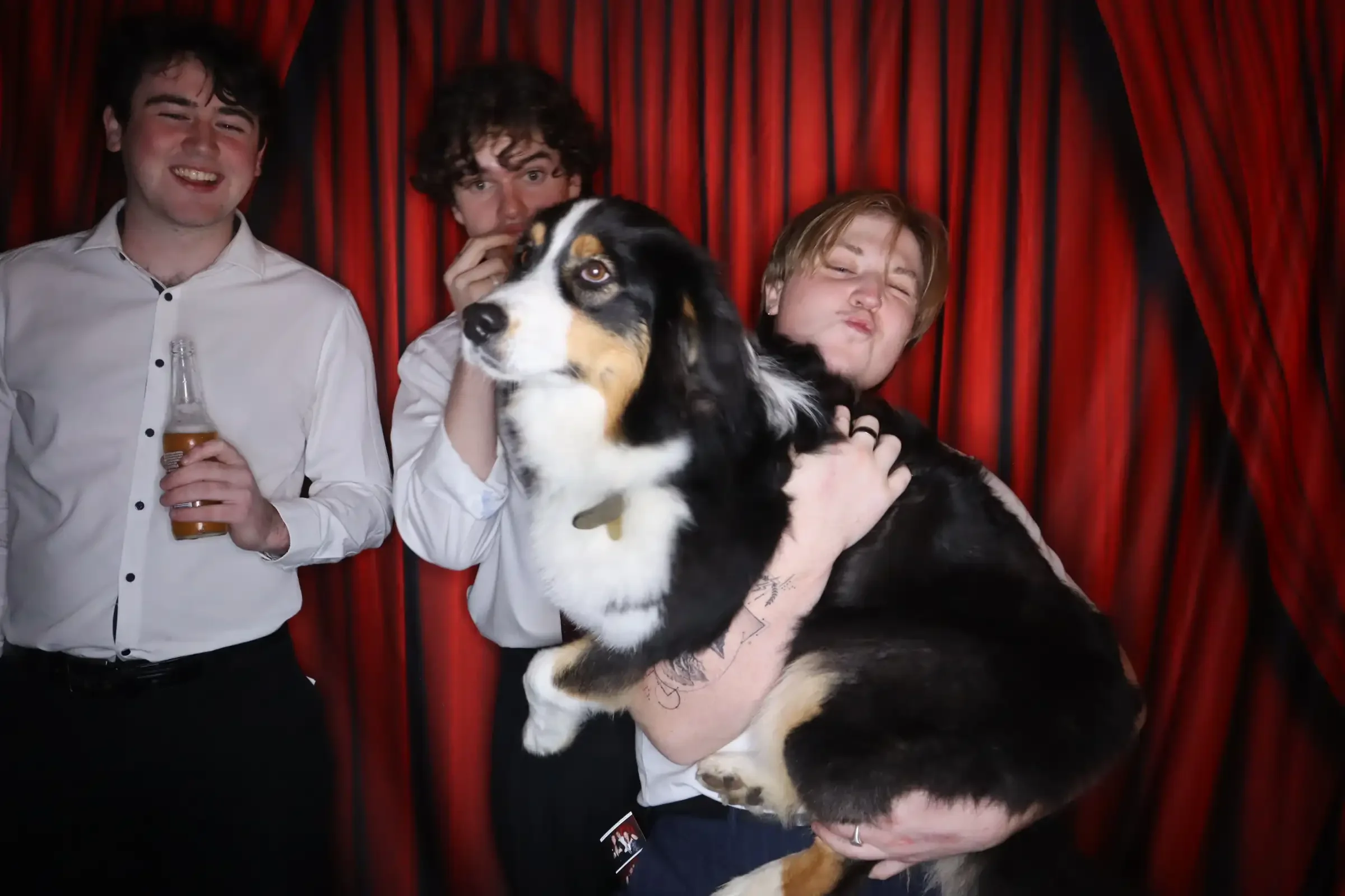 Enclosed birthday photo booth hire Melbourne guests enjoying printed photo strips
