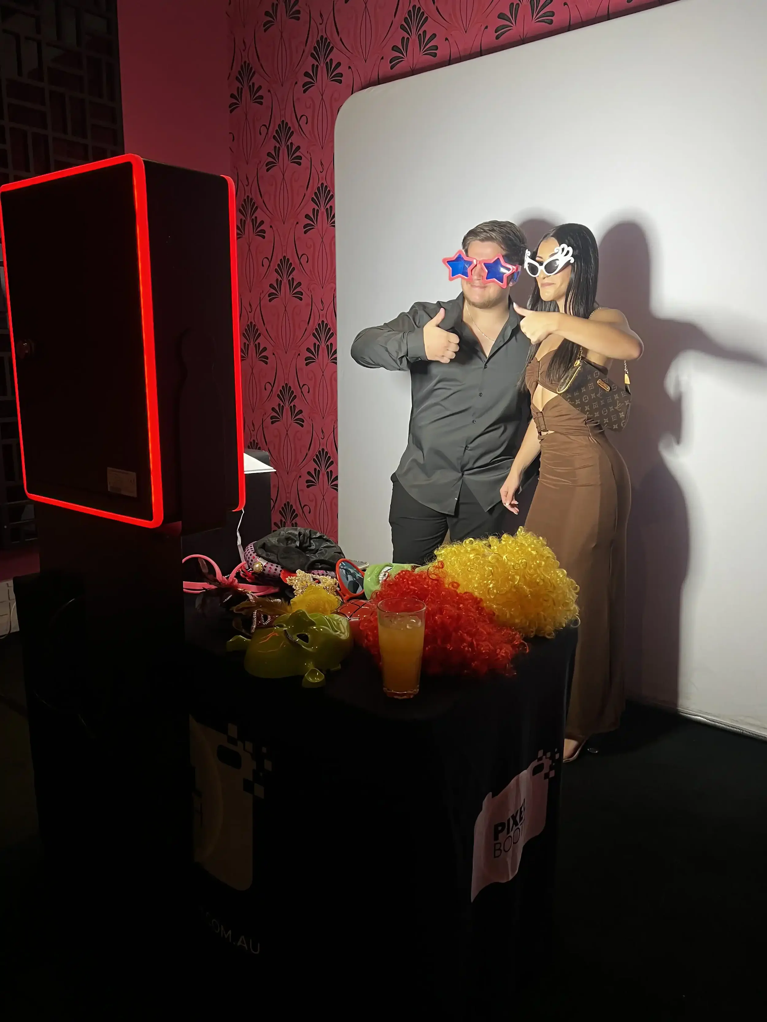 Birthday photo booth hire Melbourne guests posing at a milestone party