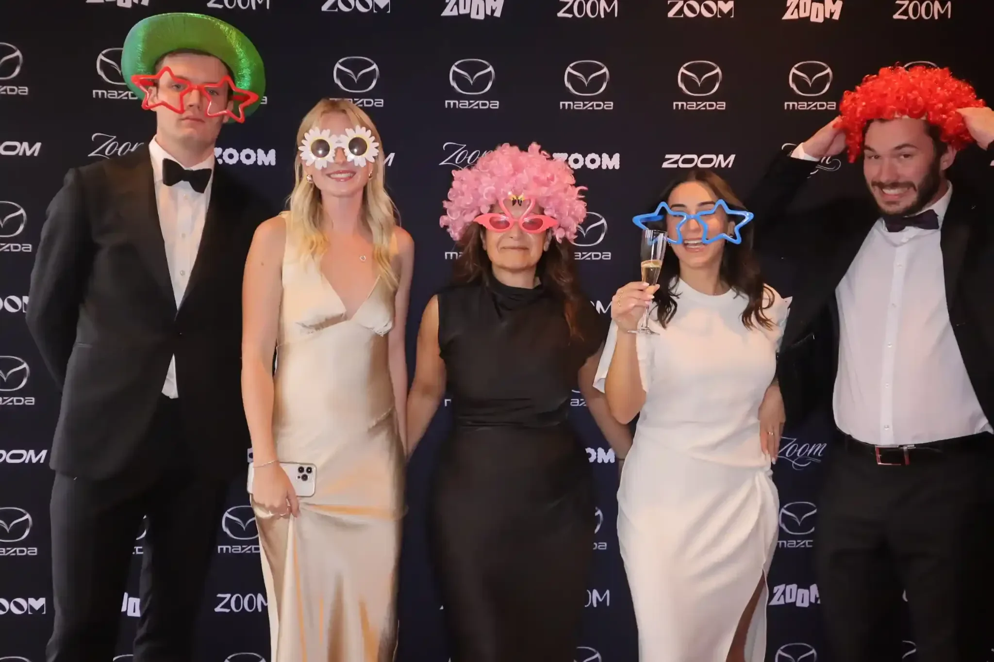 Christmas party photo booth hire guests at formal Mazda corporate event backdrop