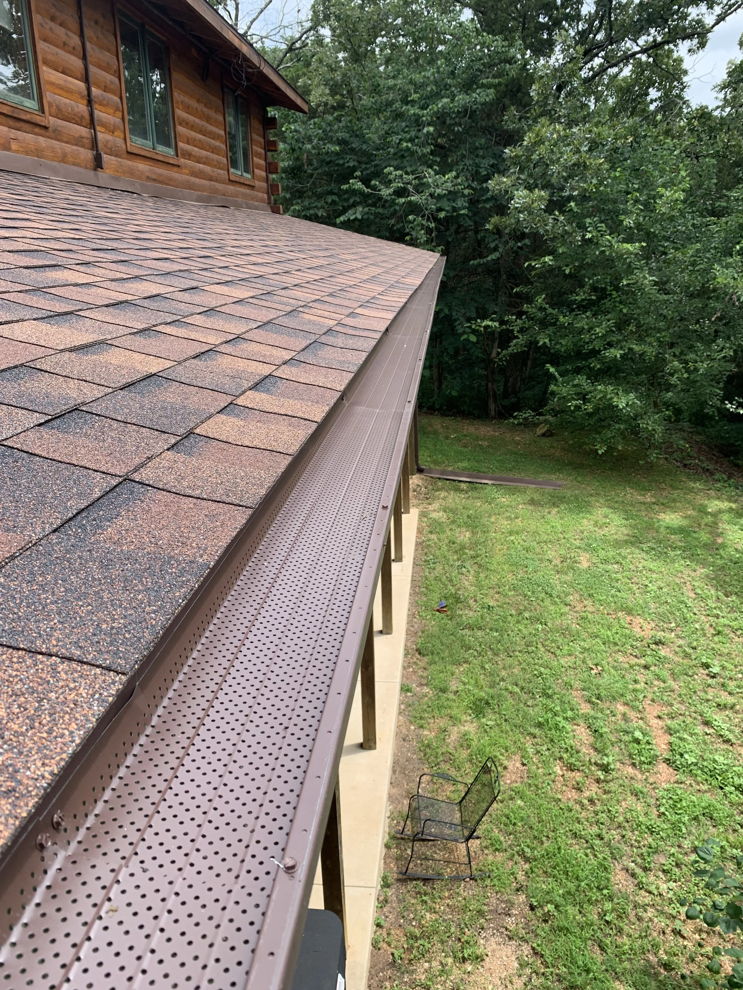 Copper gutter cover panels on roofline