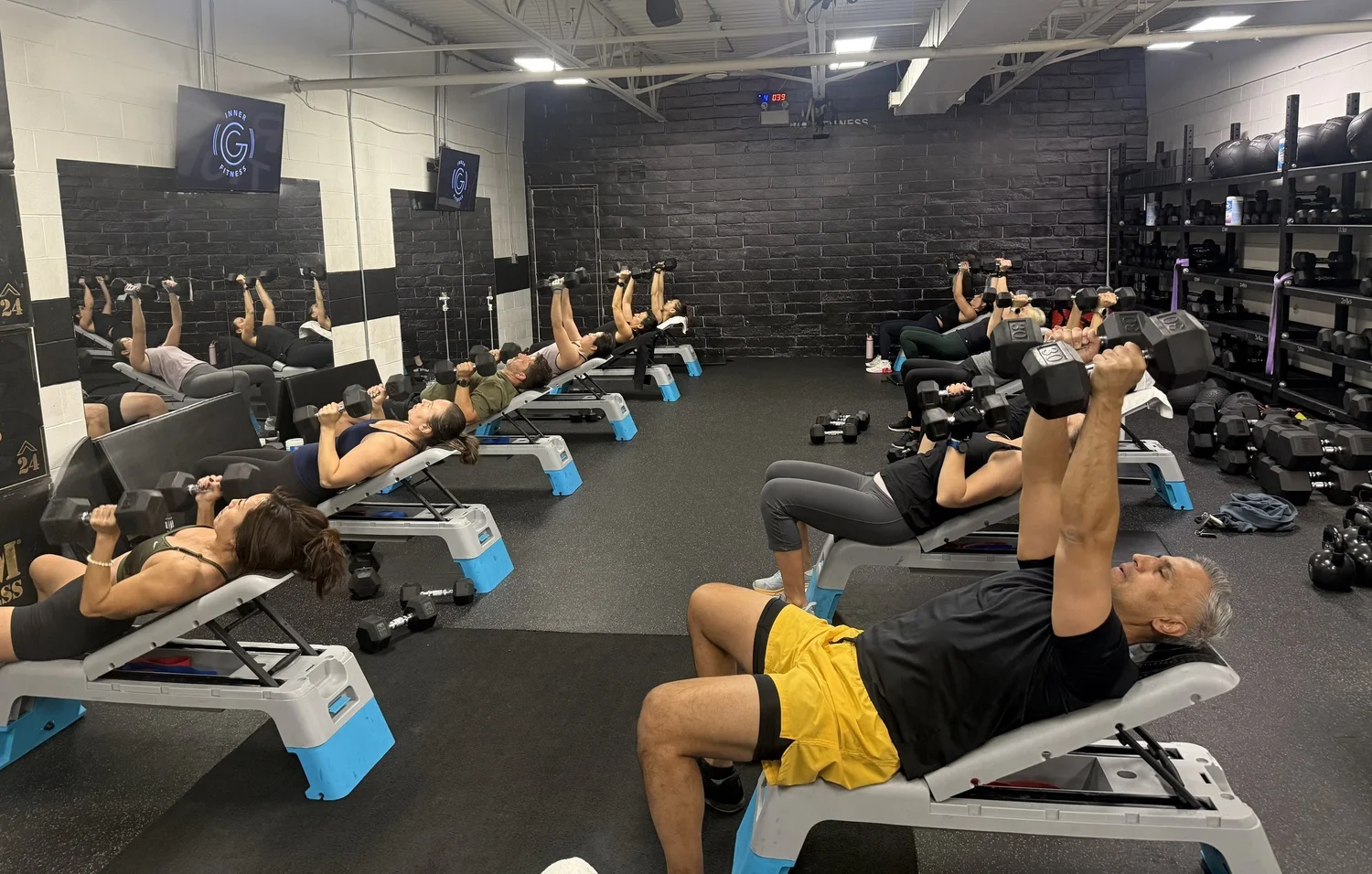 Small group class doing dumbbell presses at Inner G Fitness in Vaughan