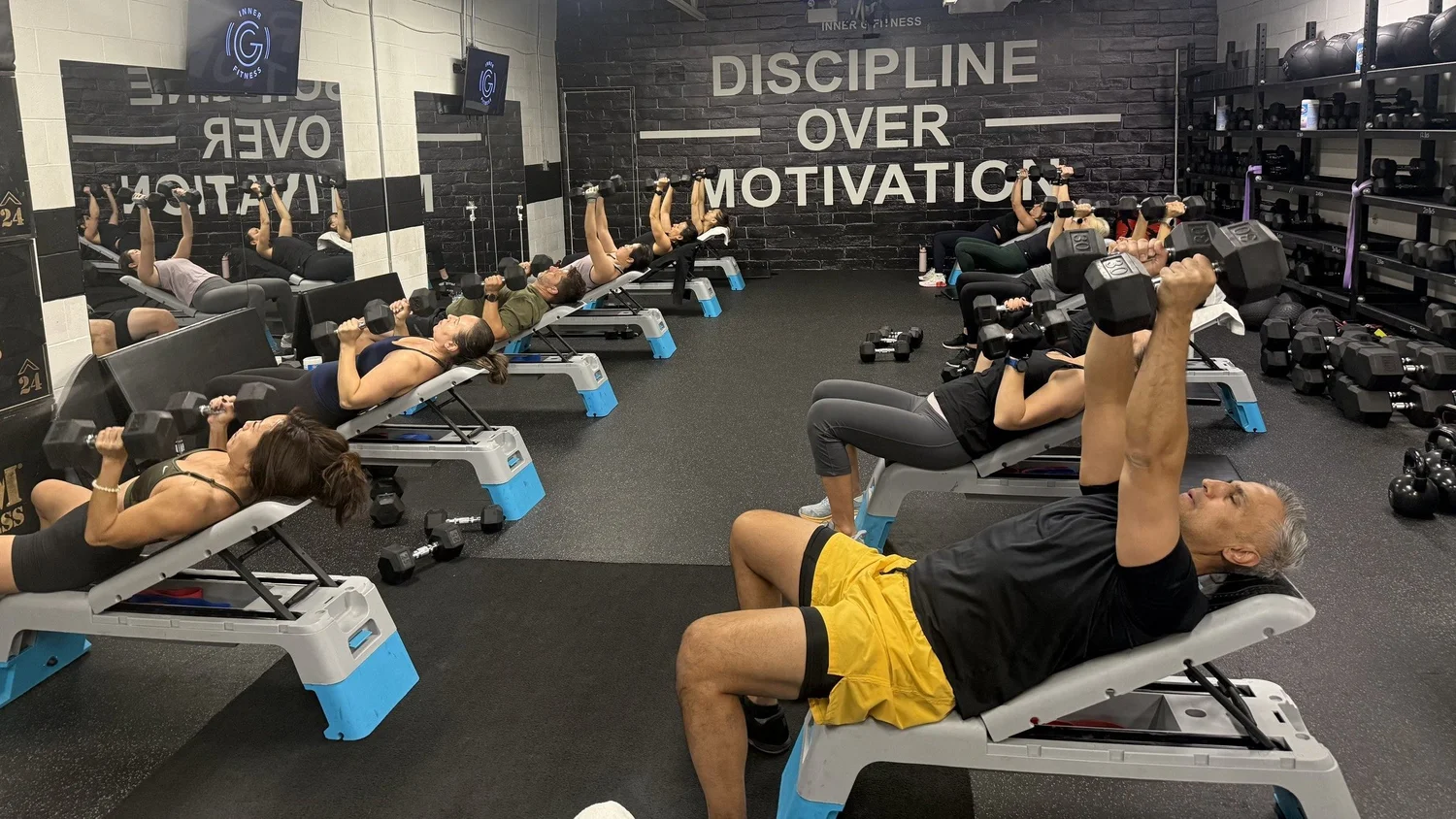 Small group class doing dumbbell presses at Inner G Fitness in Vaughan