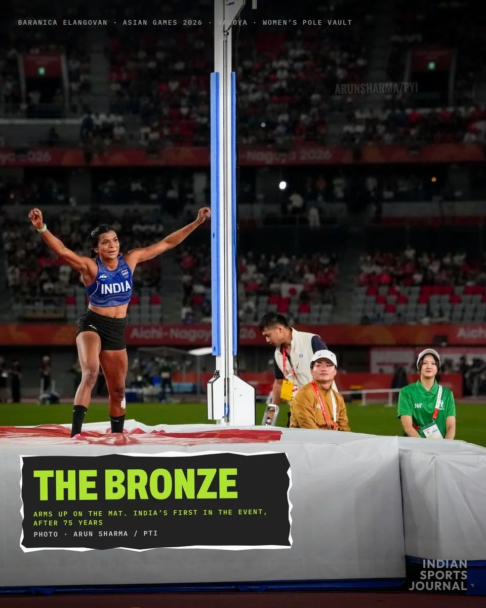 ISJ slide: The bronze, Baranica with arms up on the landing mat beside the uprights
