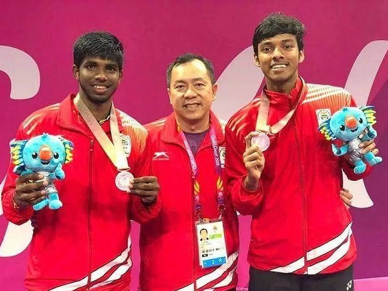 Satwik and Chirag with Tan Kim Her and their Commonwealth Games silver medals