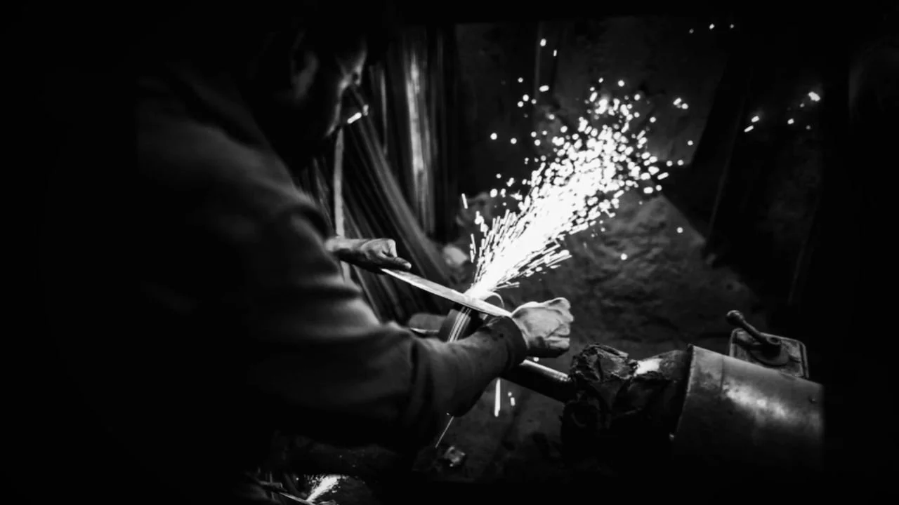 Frame 11 of 14: A shower of sparks at the grinder