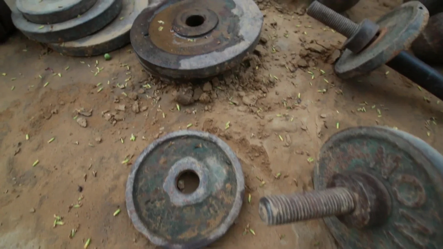 Old iron plates and dumbbells in the earth